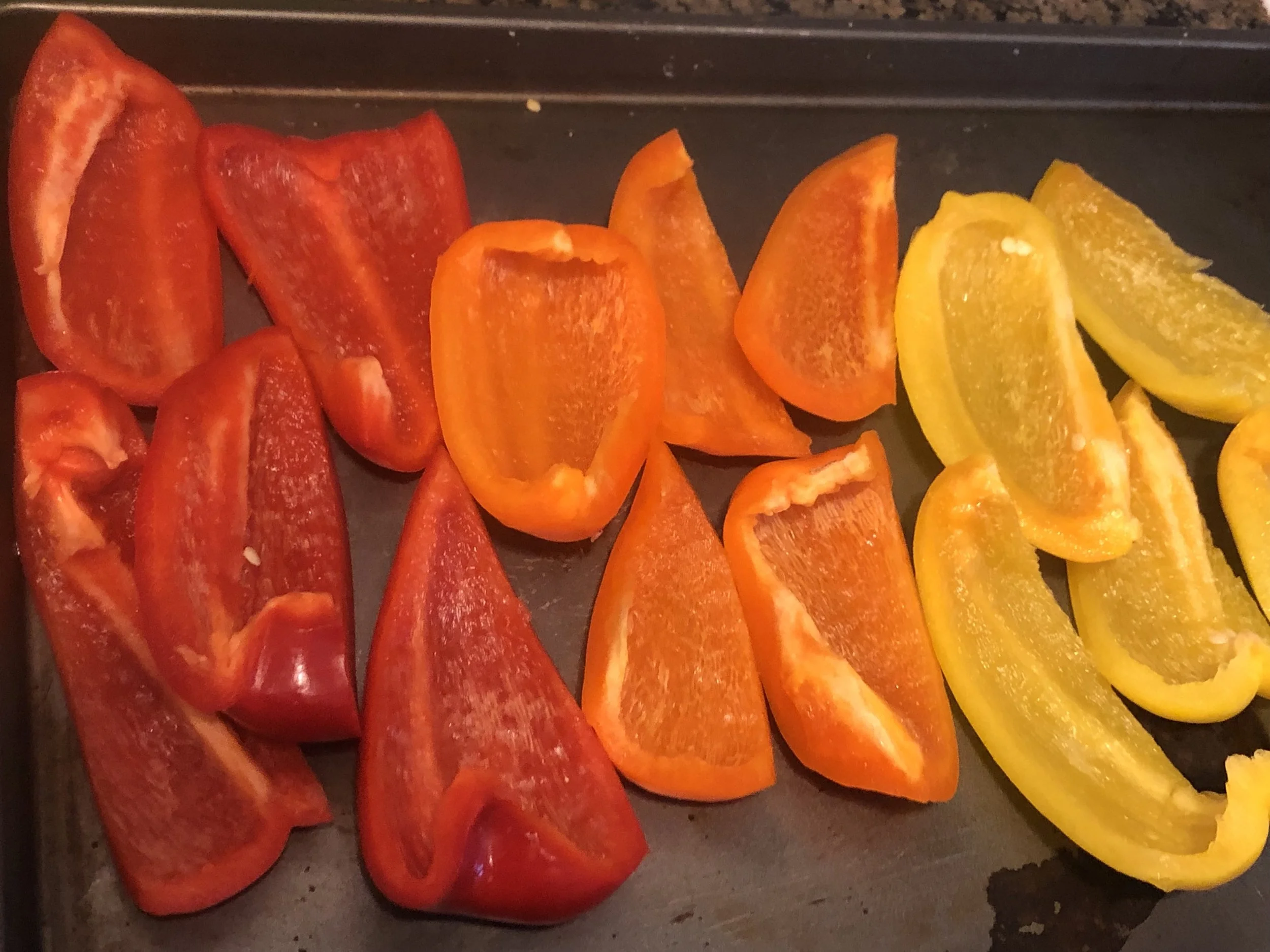 Cut bell peppers in half lengthwise and remove stems, ribs, and seeds; discard. Place bell peppers on a rimmed baking sheet and drizzle with 3 Tbsp. oil; season with salt and black pepper. Toss to coat, then turn cut side down and broil bell peppers on top rack, turning baking sheet front to back halfway through, until skins are blackened all over, 15–20 minutes.