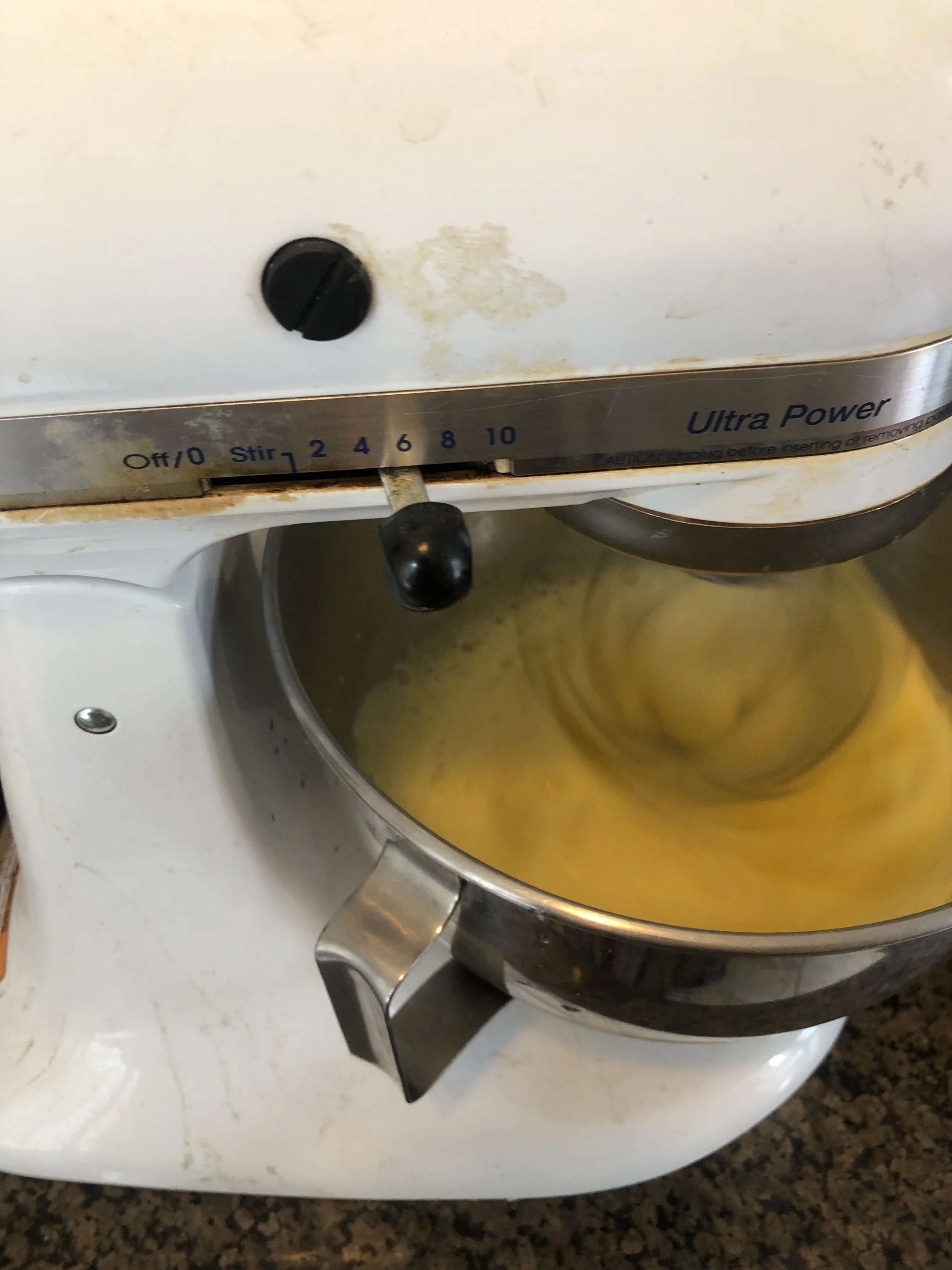 Add your eggs to your stand up mixer and whip until light yellow and the mixture makes sift peaks, but before it make meringue like stiff peaks.