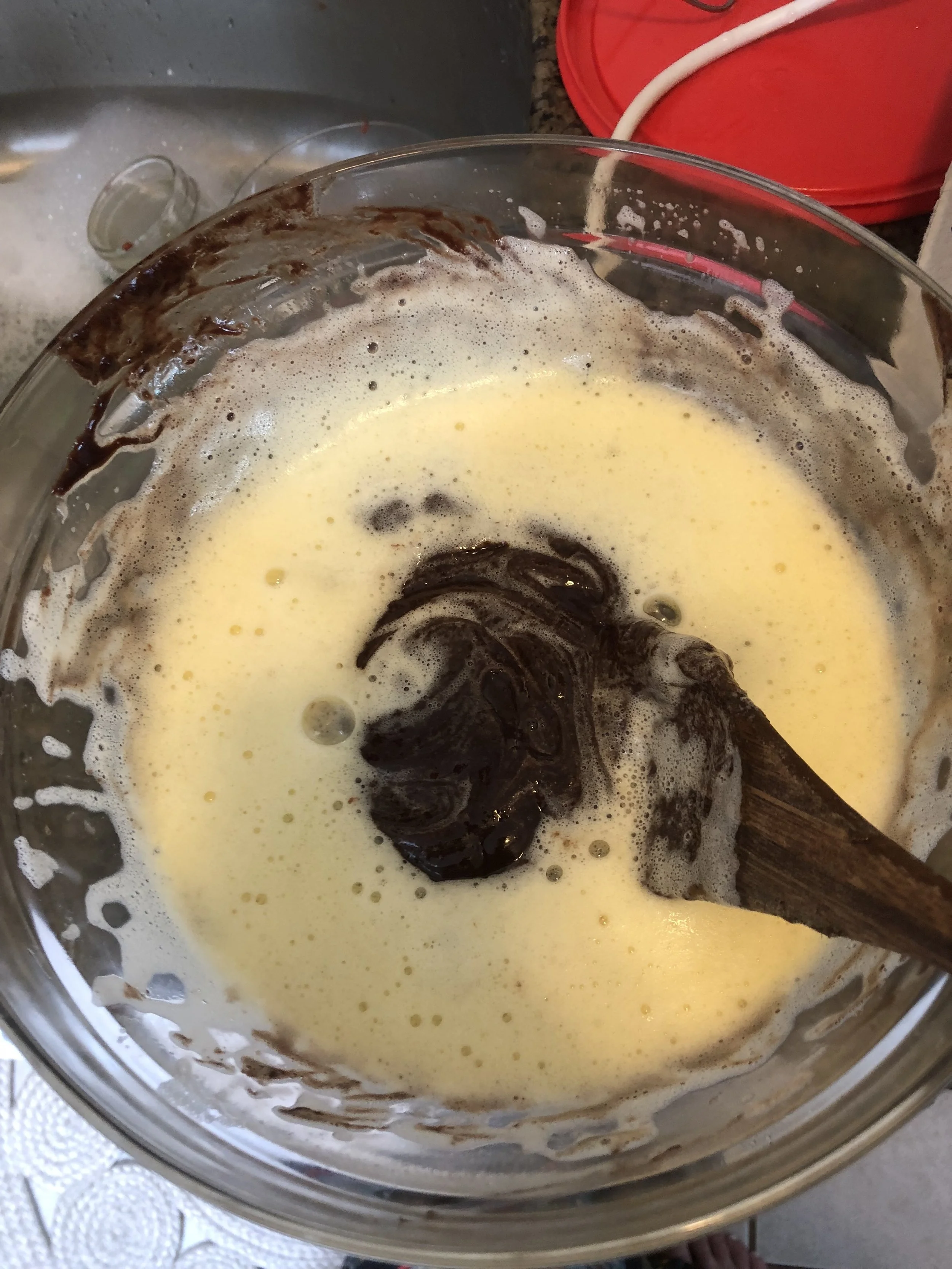 Pour, in batches, the cooled chocolate mixture into the egg mixture, making certain you have integrated the chocolate completely before adding more of the echolocate mixture