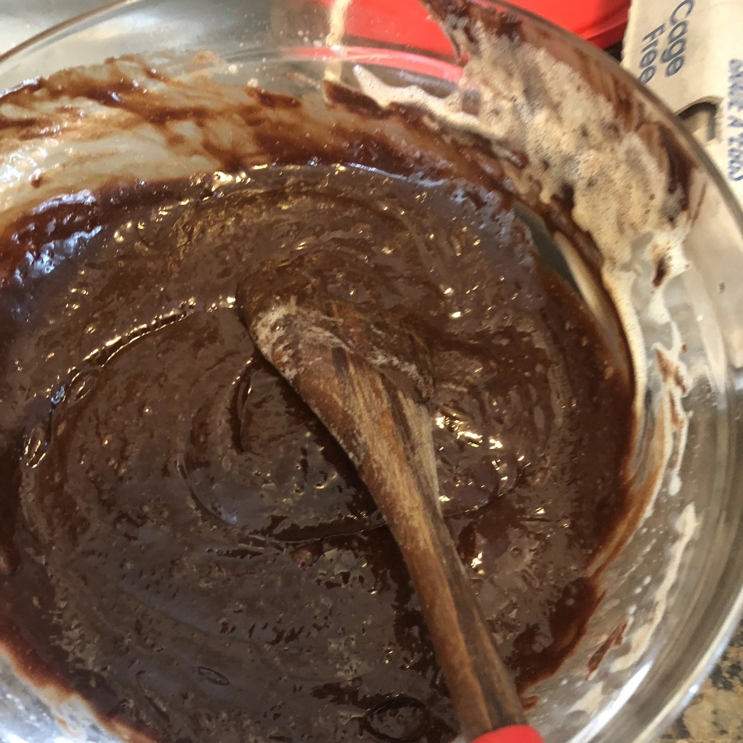 The mixture should resemble a very smooth cake batter when completely integrated. Pour the batter into a foil lined springform pan and place the pan on a baking sheet. Place in the oven for 36 -41 minutes.