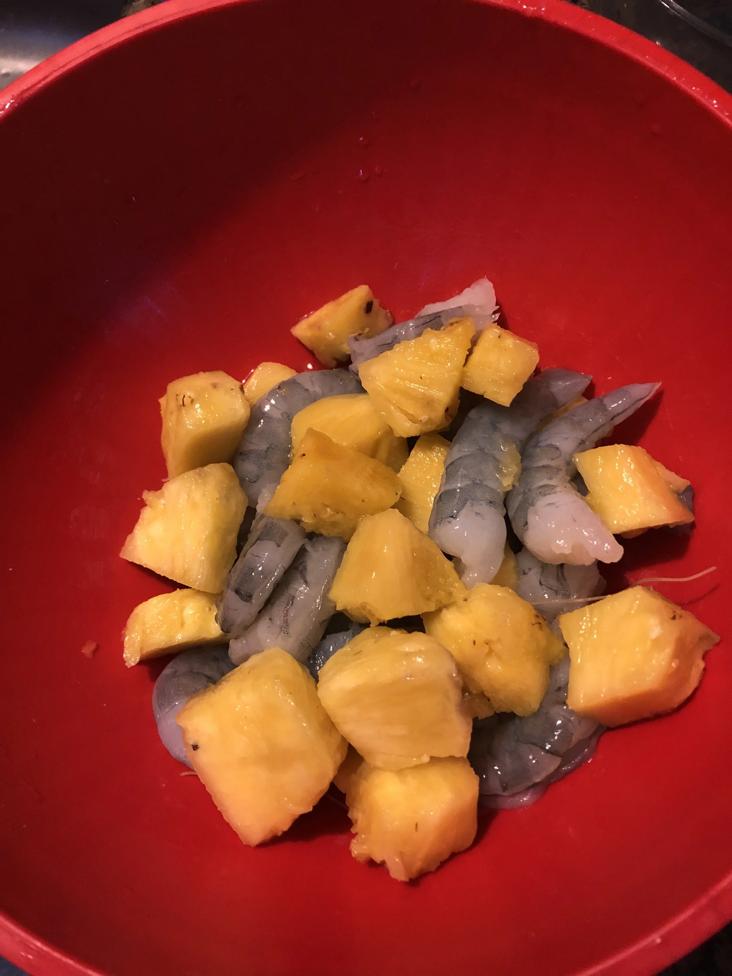 Plan of Attack Core your pineapple and cut into medium pieces Defrost (if necessary), clean and pearl your shrimp Add the shrimp, pineapple, ginger, and soy sauce to your medium mixing bowl and let marinate. While the mixture marinates, cook the noodles according to package directions and set asaide
