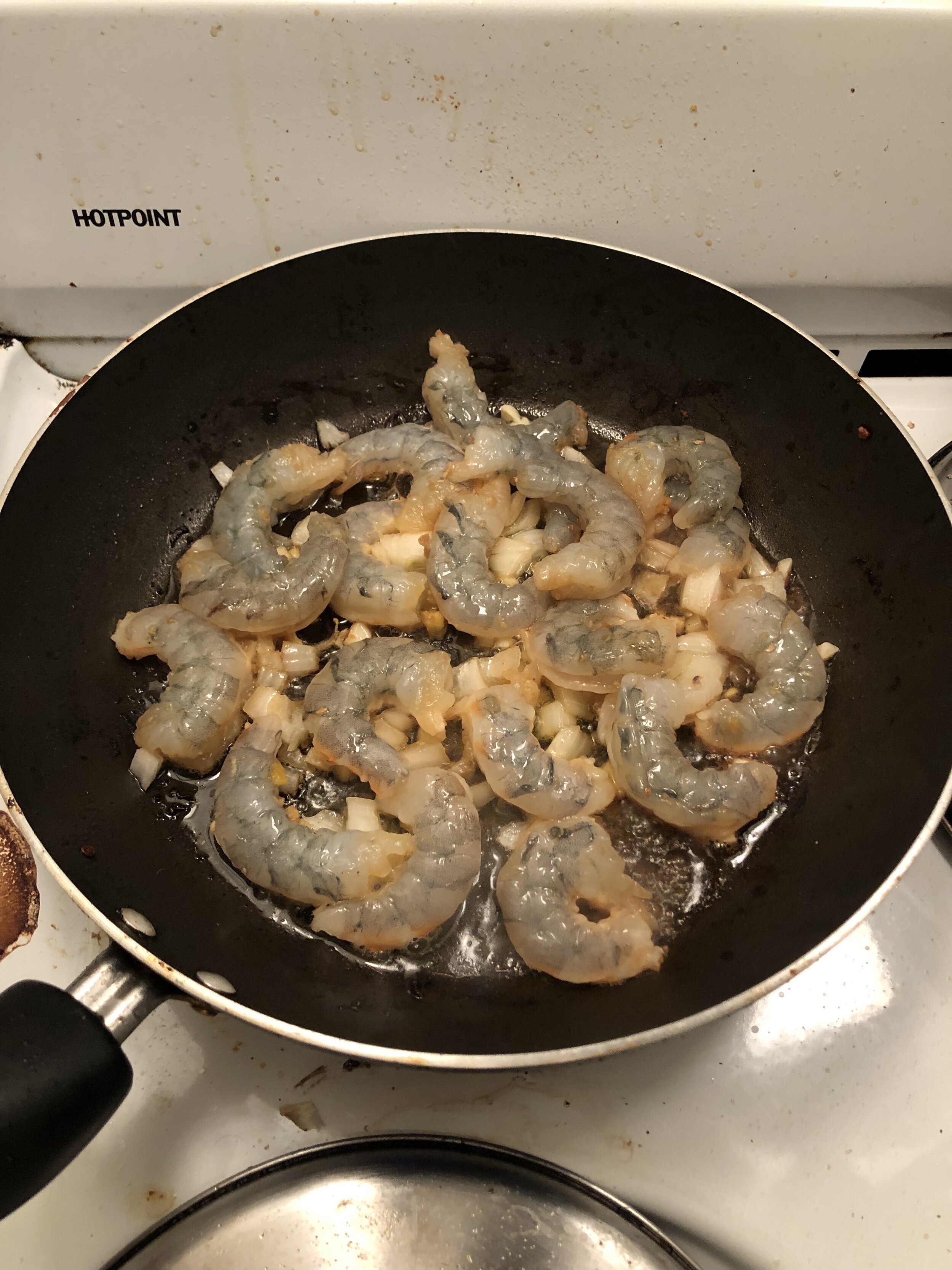 Add some diced onion/shallot and 3 garlic cloves (diced) to the drippings from the same pan and when aromatic, add the shrimp to the pan. Cook the shrimp until done (salmon color on both sides). Remove the shrimp from the pan and put on the pineappl…