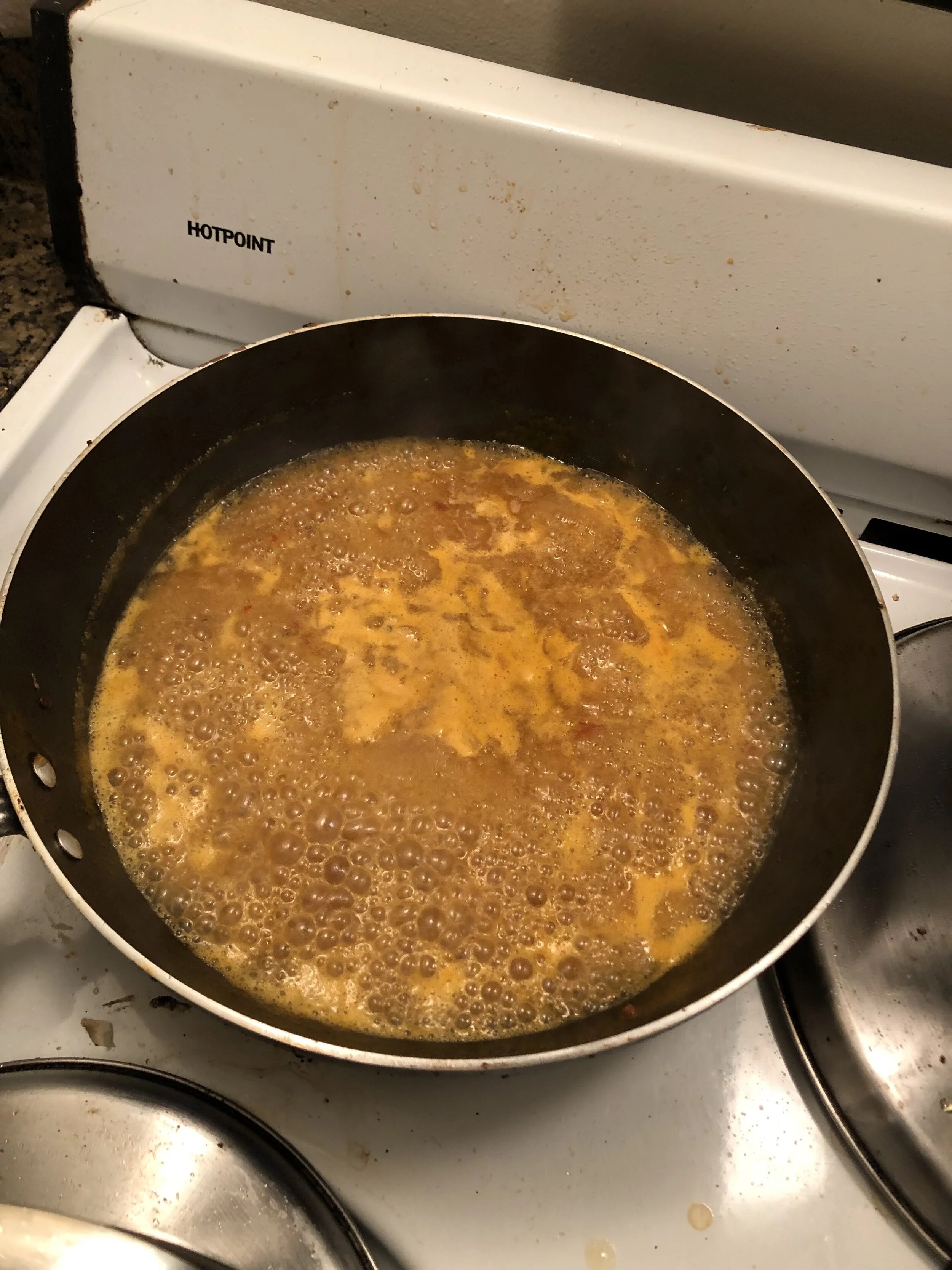 Add the Thai garlic sauce and the juice to your skillet and then cook until the water cooks out and the mixture is syrupy.
