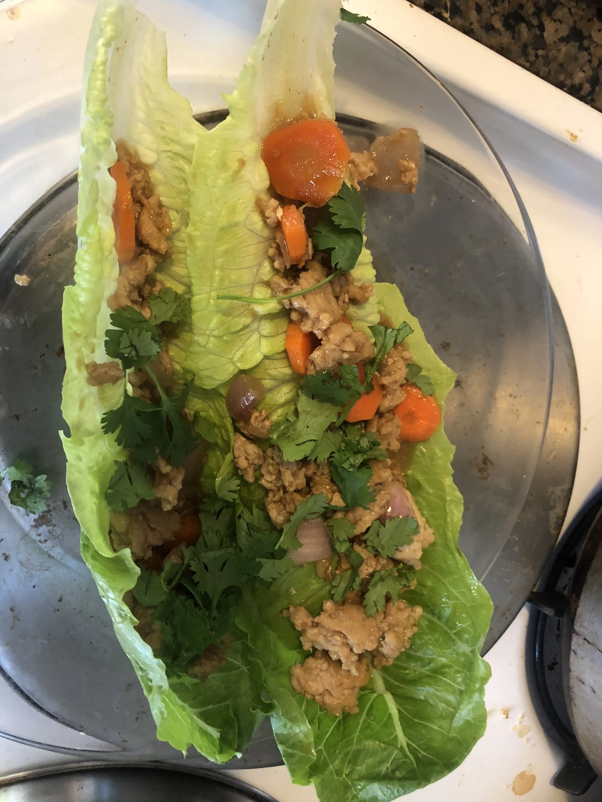 Ingredientslb ground chicken2-3 medium carrotsmedium onion, cleaned and diced3 garlic cloves diced (5-6 if they are sm cloves)ginger root3 tbls of vegetable or olive oilhead of lettuce0.25 cup of soy sauce0.25 cup of miso0.5 cup of watergreen onions…