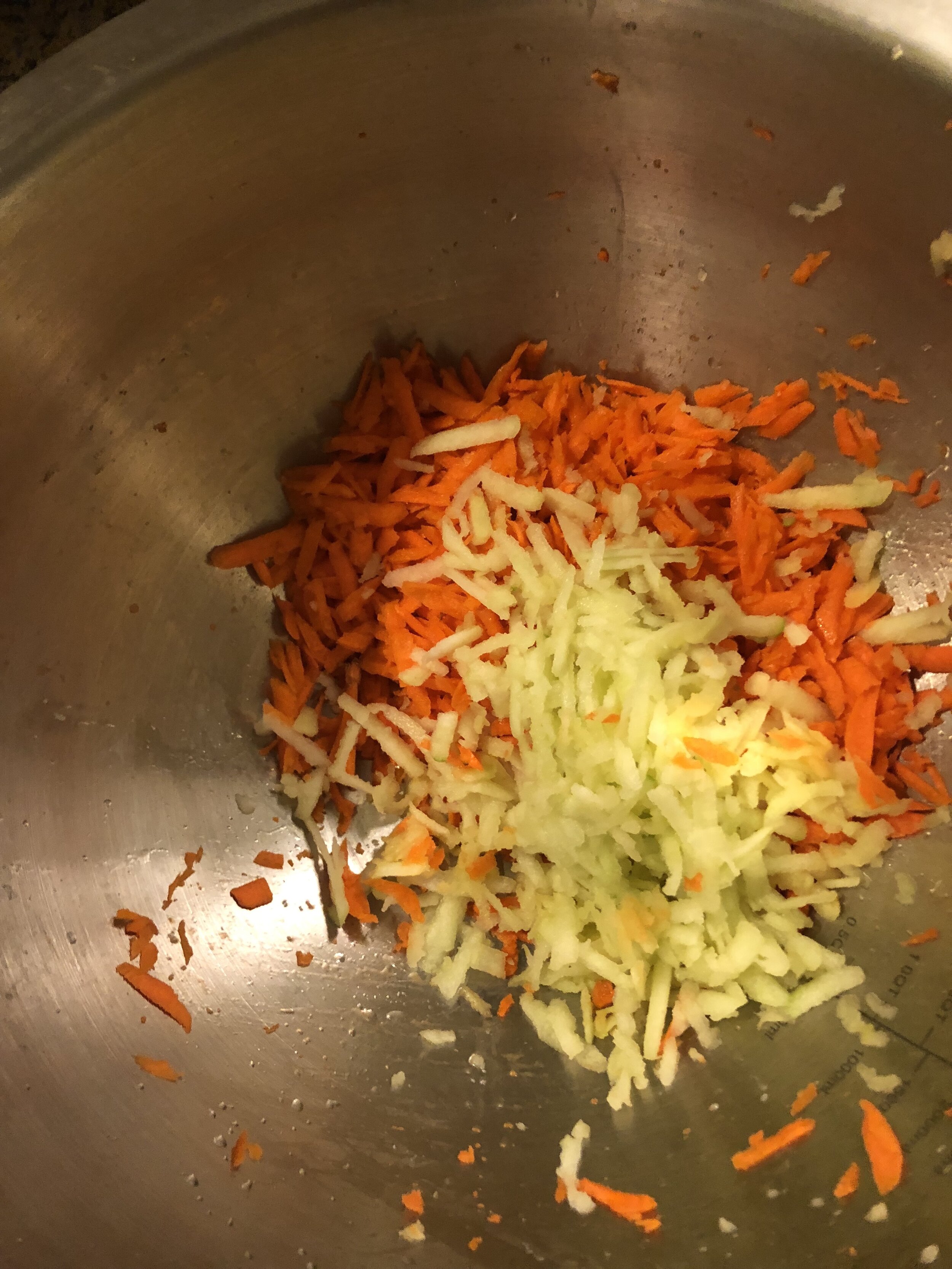 Peel and grate the apple into the same bowl of as the carrots and then add sunflower seeds, and raisins (optional). In your other mixing bowl, mix the flour, sugar, baking soda, spices and salt. Add this mixture into the apple mixture. Mix throughly…