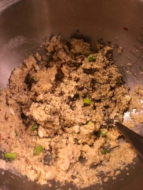 Add salt, pepper, whisked eggs, matzo meal and diced scallions in the bowl and mix thoroughly.