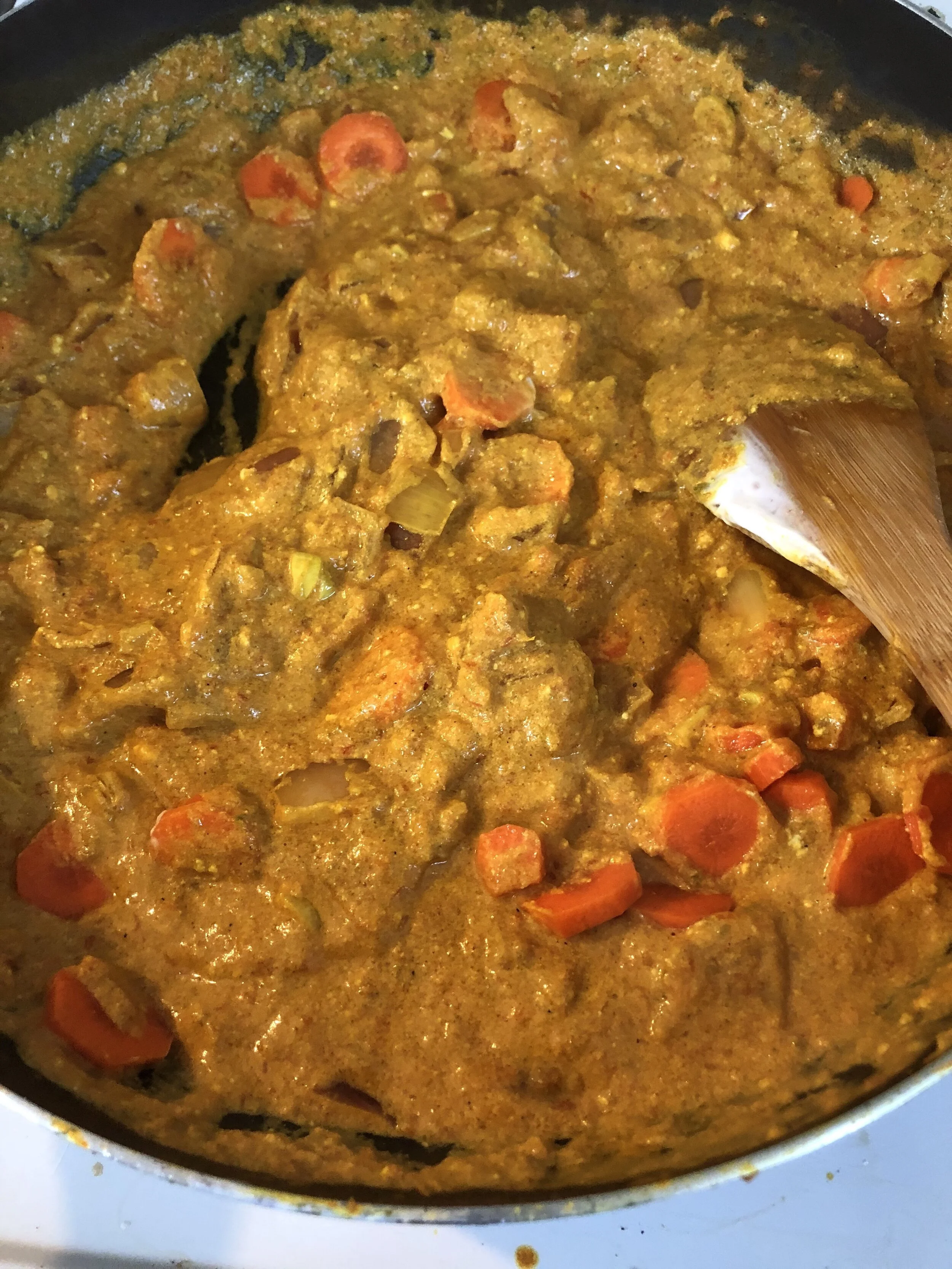 When the carrots and potatoes have cooked for 5-6 minutes add the yogurt and coconut milk. This recipe called for a tsp of Tumeric but I actually added a tbsp and you can see this from the beautiful mustard color of the dish.