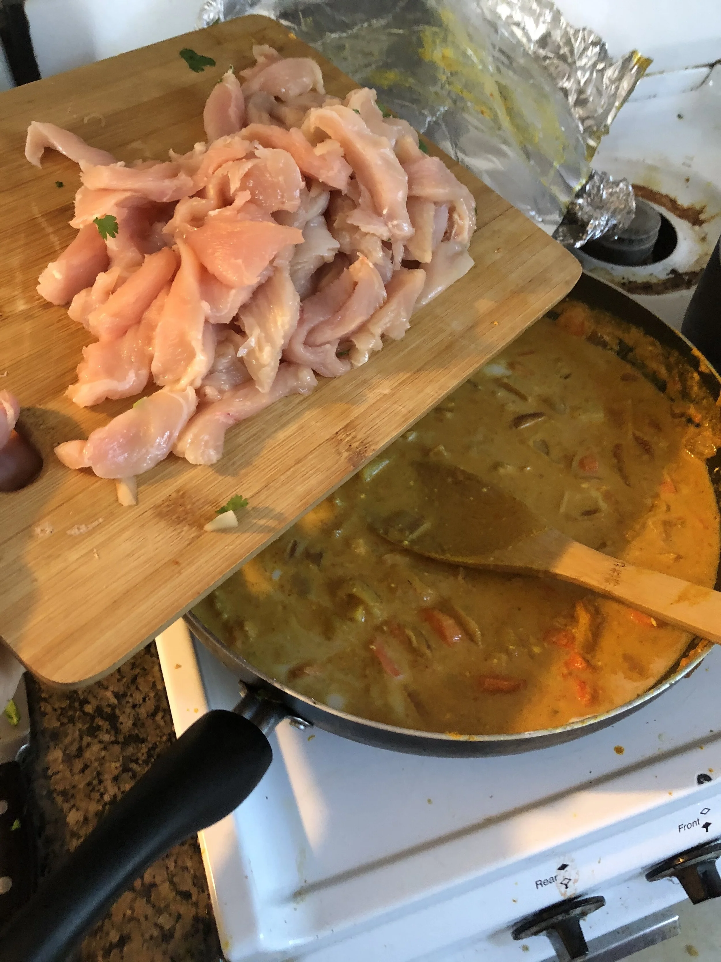 Add the chicken, cut into bite sized pieces into your pan as well as the cilantro. Cover and cook fro 22-25 minutes.