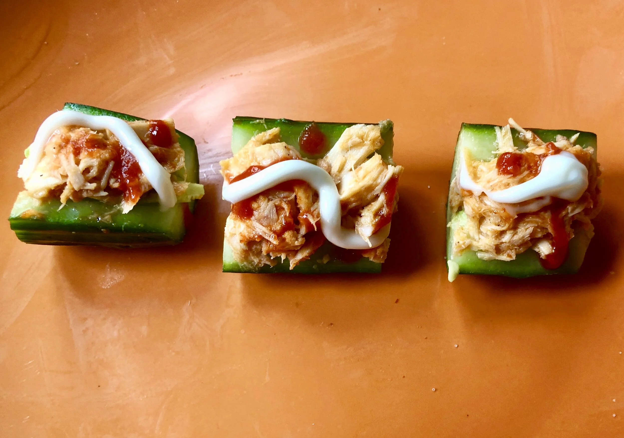 IngredientsThe firmest English cucumber you can findCan of Tuna (in oil or water) - drained2 tbs of mayonnaise (have it on hand though you may not use this much3 tbls of Siracha (2 for the tuna and the 3rd, still in the bottle, to garnish)tsp of pow…