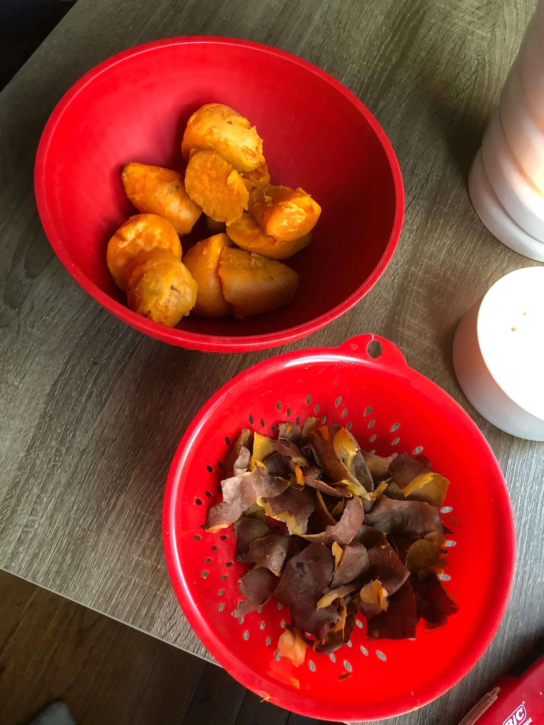 Peel the cooled potatoes and discard the skins. Yes, I know the skins have vitamins! Mash the potatoes with either your potato masher or your hands. I used my hands because my potato masher mysteriously grew legs and walked away to mash another lady…