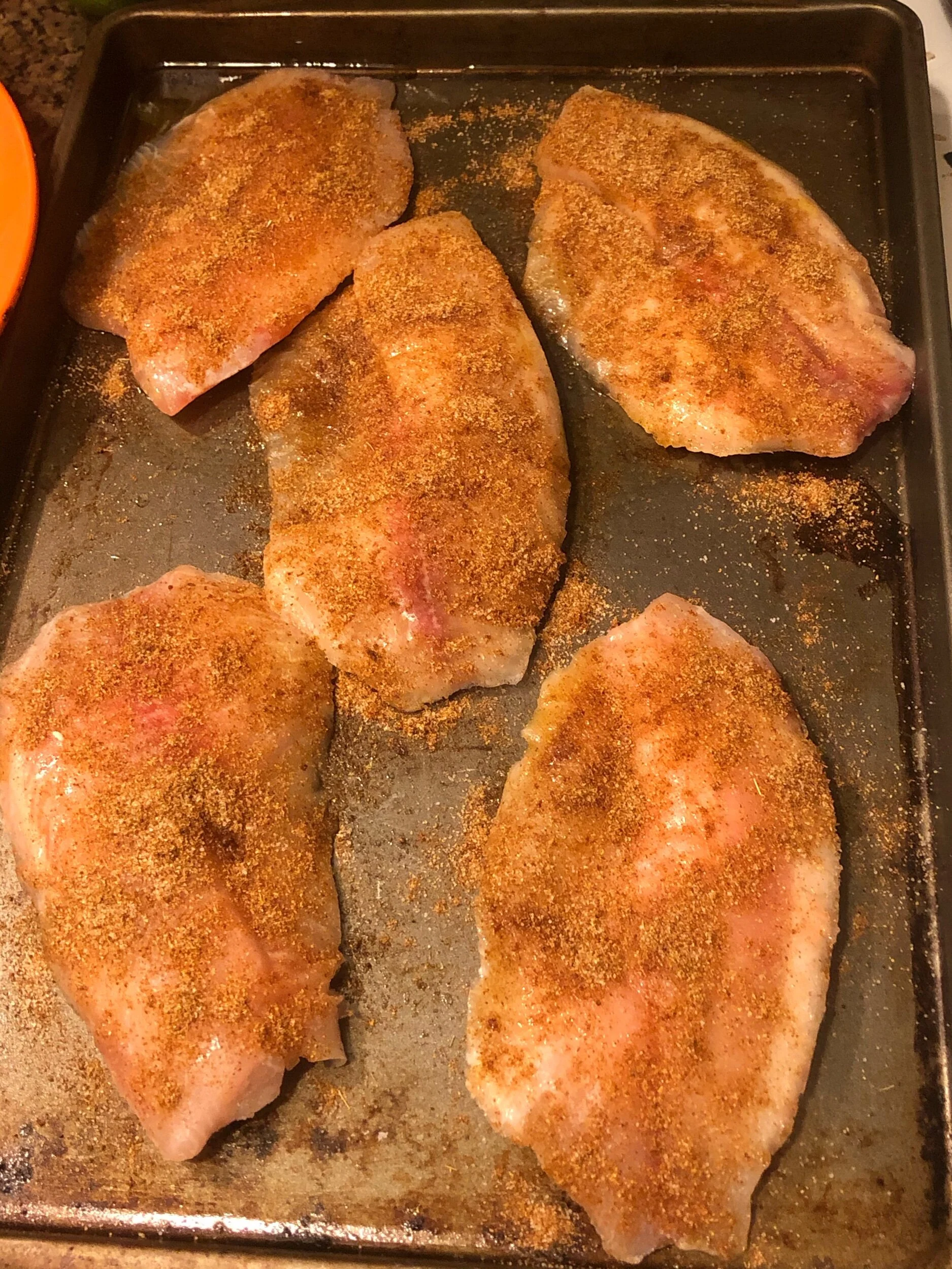 Coat the fish with the spice rub and place on your sheet pan. Put into your oven and cook until it flakes easily with your fork.