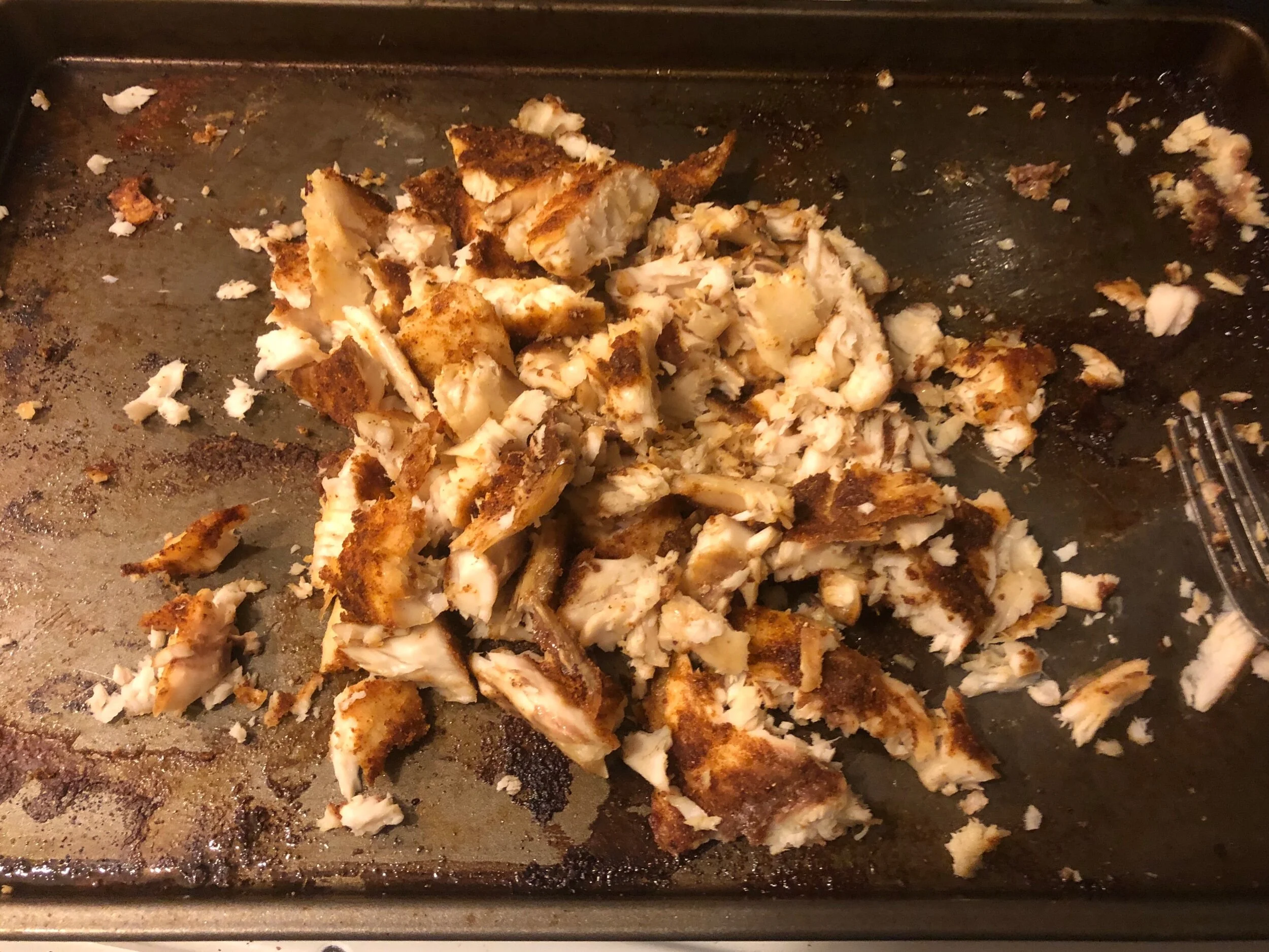 When the fish is cooked and looks as if it is done browning, shred the fish with your fork and put to the side. You can keep it warm or let it cool according to your preferences.