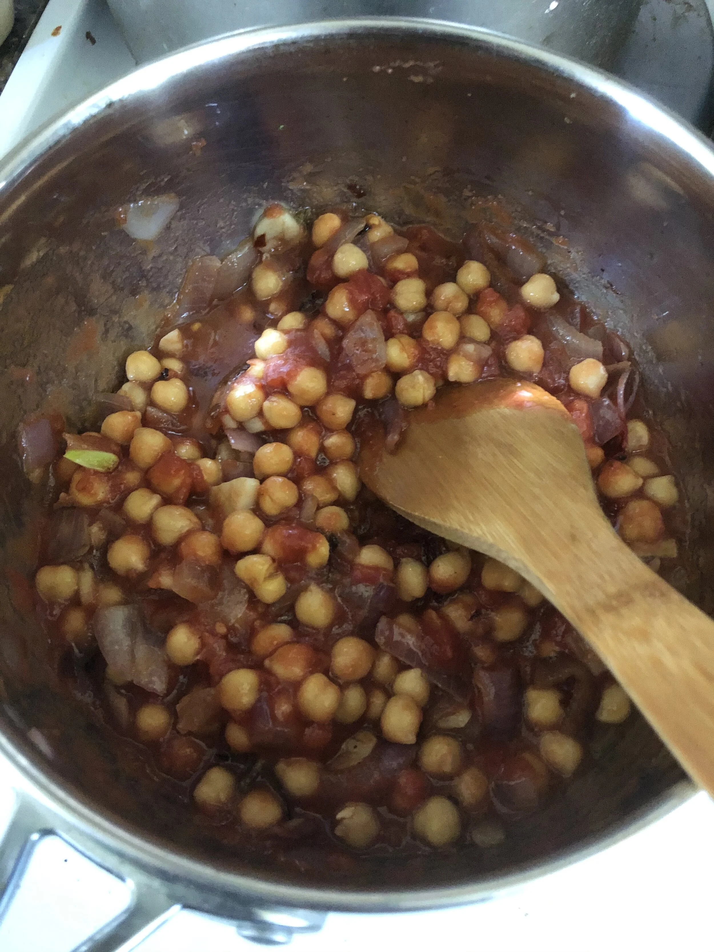 Add the chickpeas, tsp of powdered garlic, tsp of salt, tsp of pepper, tomatoes and Rosemary to a medium sauce pan. Cook for 5-6 minutes and until the chickpeas begin to soften.