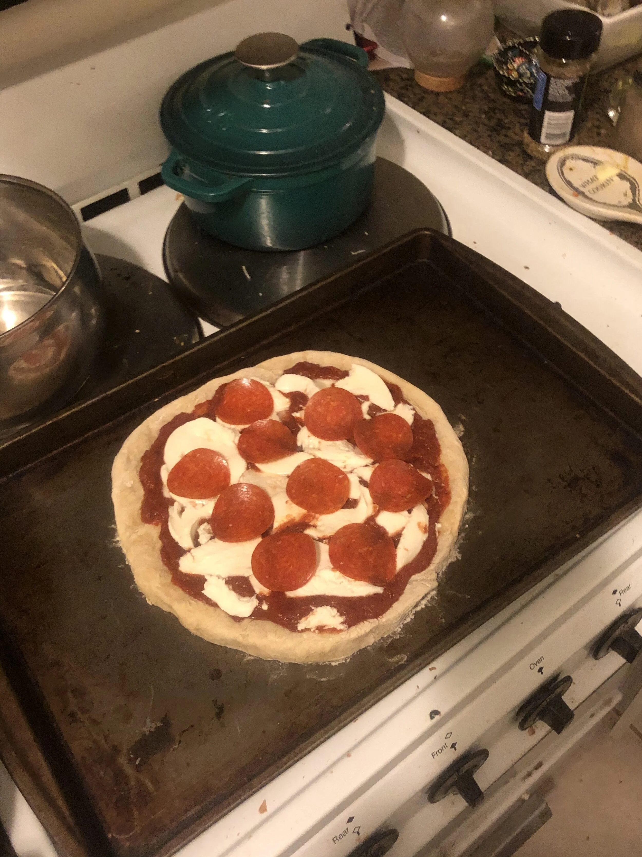 Cover in desired toppings (pictured- homemade sauce, local cheese and pepperoni) and cook for 15-25 minutes, depending on your oven character.