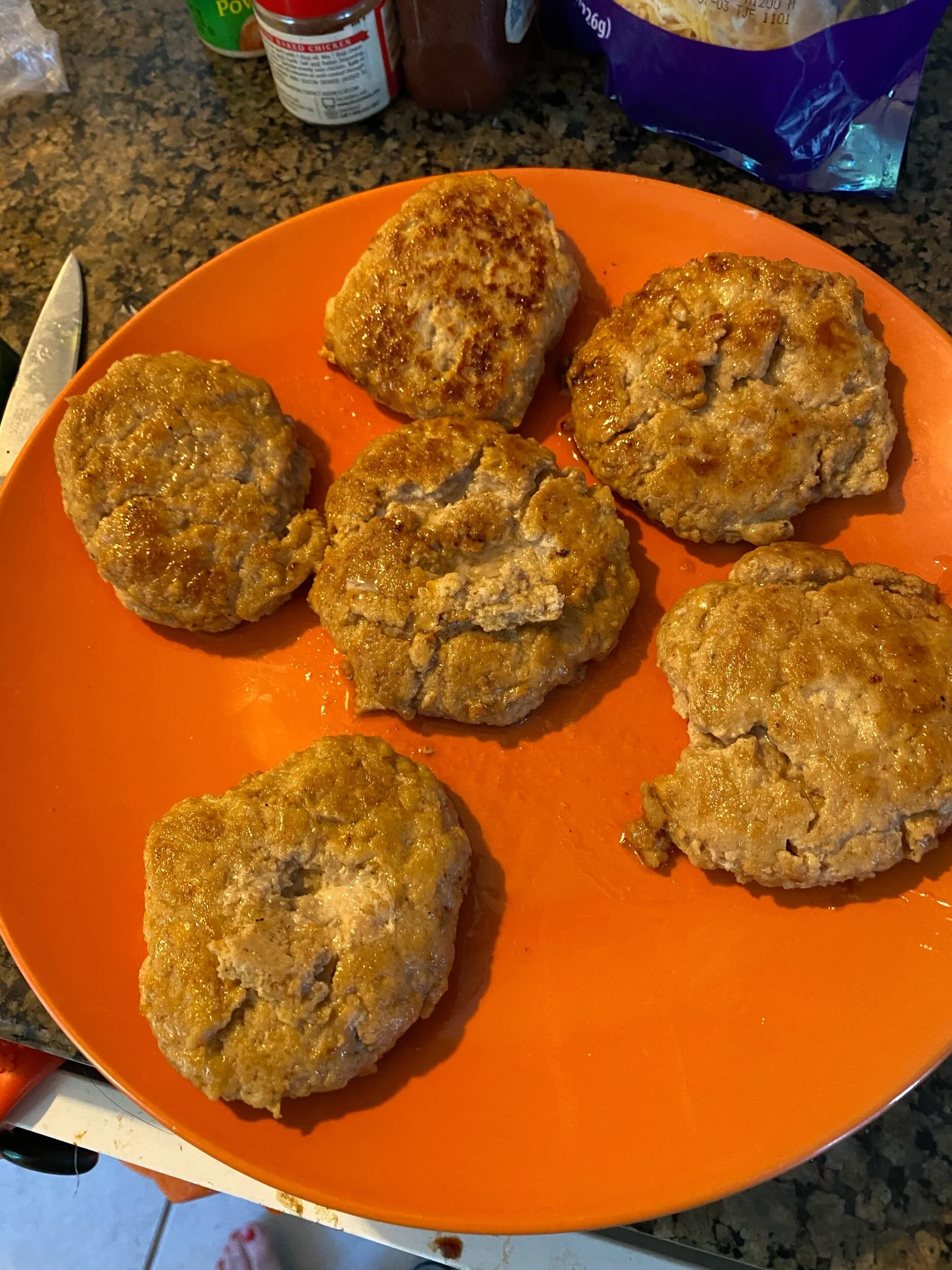 Keep your burgers warm and serve according to your preferences for garnish.