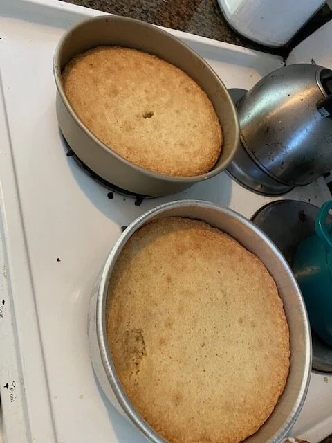 Let cakes cool in the pans on a wire rack for 30 minutes. Run a knife around the edge of each cake, invert onto rack, and remove the parchment. Let cool completely.