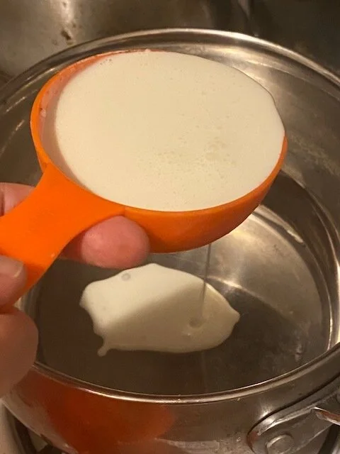 Measure your heavy cream and add to your medium saucepan. Heat, stirring frequently until it is hot but not boiling