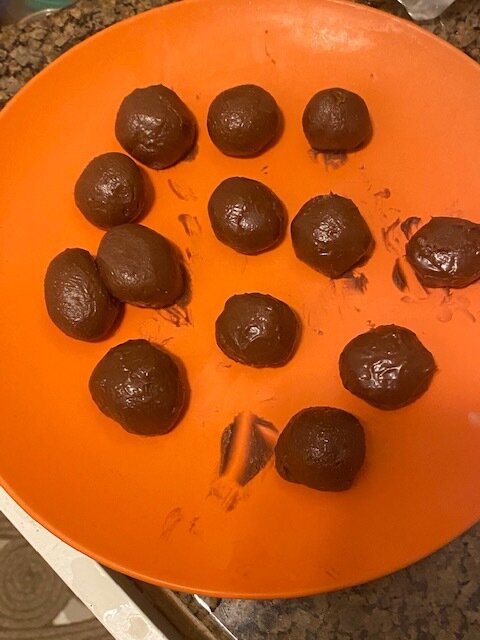 Using your hands roll into symmetric balls and if they start to become sticky refrigerate until they are “hard” on the outside.