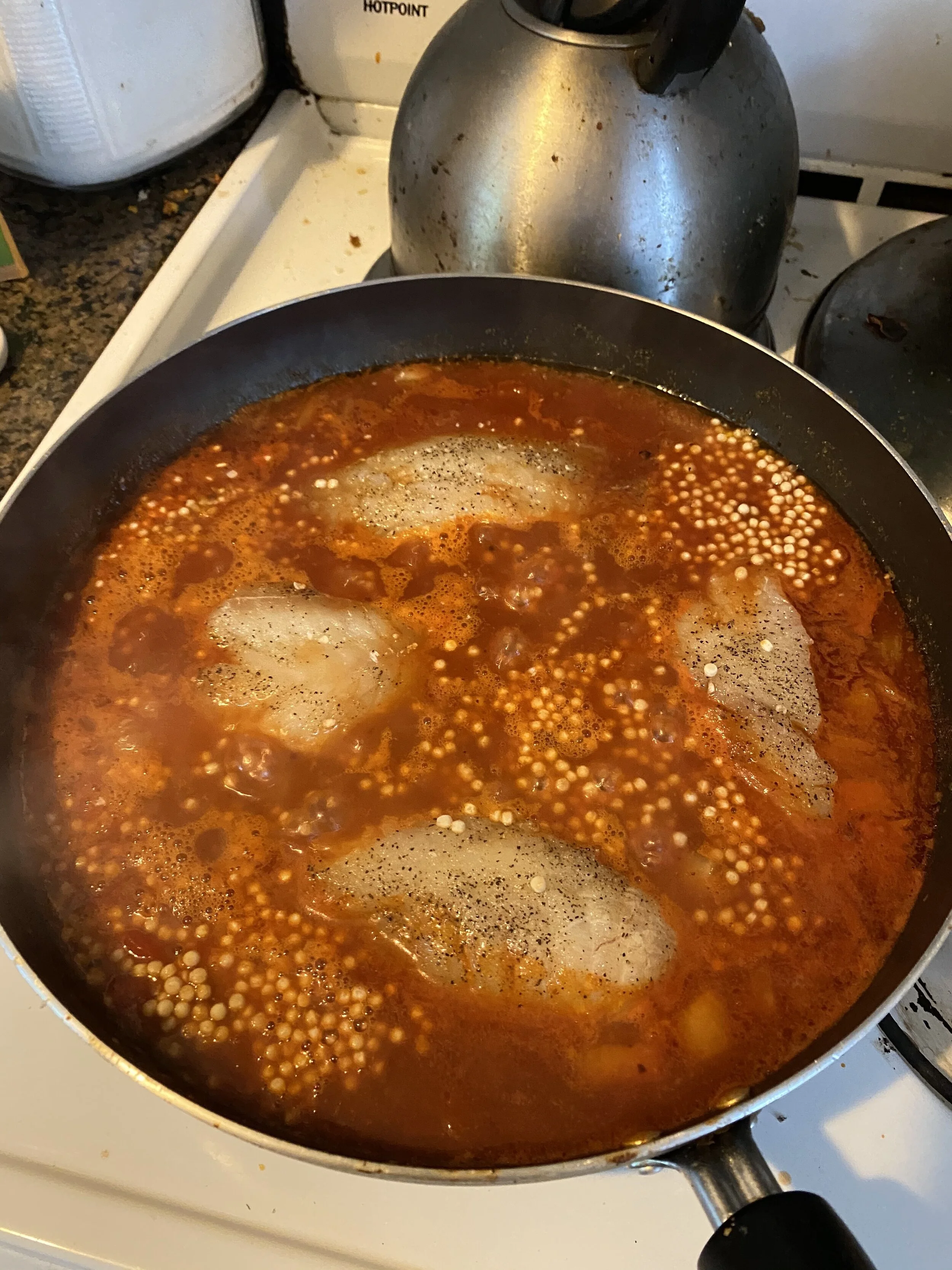 Add the Israelii / pearl couscous, cover, and cook the fish until it is opaque and flakes easily.