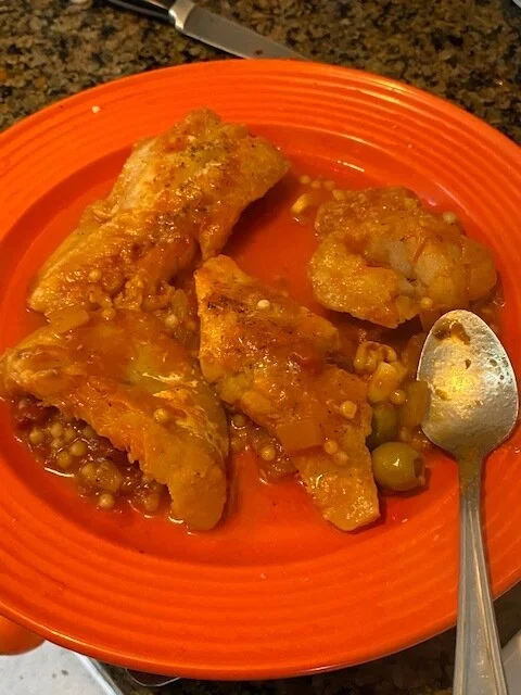 Remove the fish and cook the sauce down until your couscous is done and sauce is not watery. Serve in shallow bowls wIth couscous mixture on the bottom and a hot fillet of cod on top.*i RECOMMEND actually adding before you add the fish but i am bein…