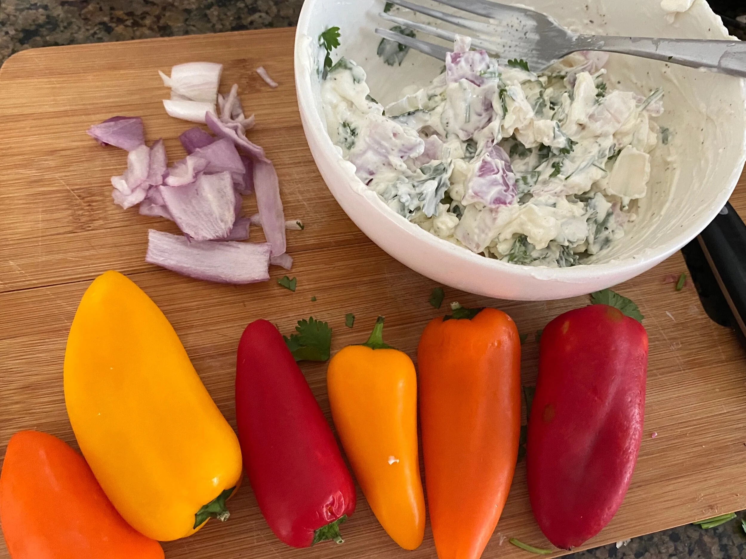 Add the diced cilantro, chopped shallot, salt, pepper, and sour cream to your sm boWl and mix throughly