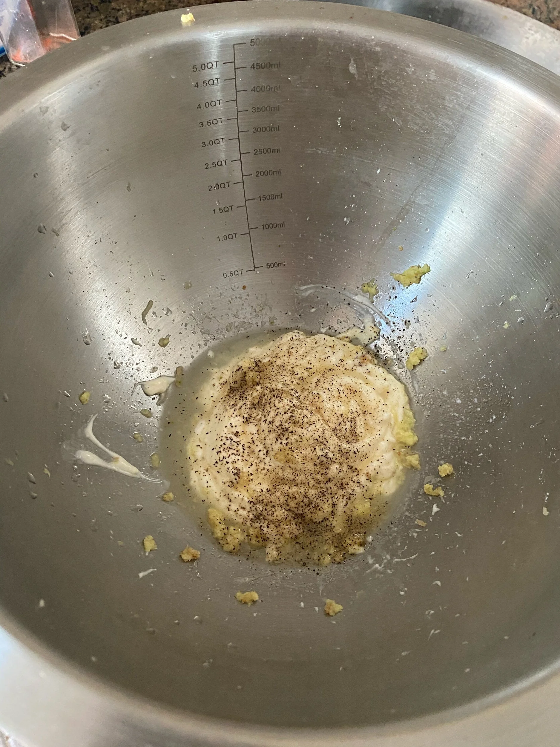 Add the mayonnaise, lime juice, grated ginger, saLt and pePper to your mixing boWl.
