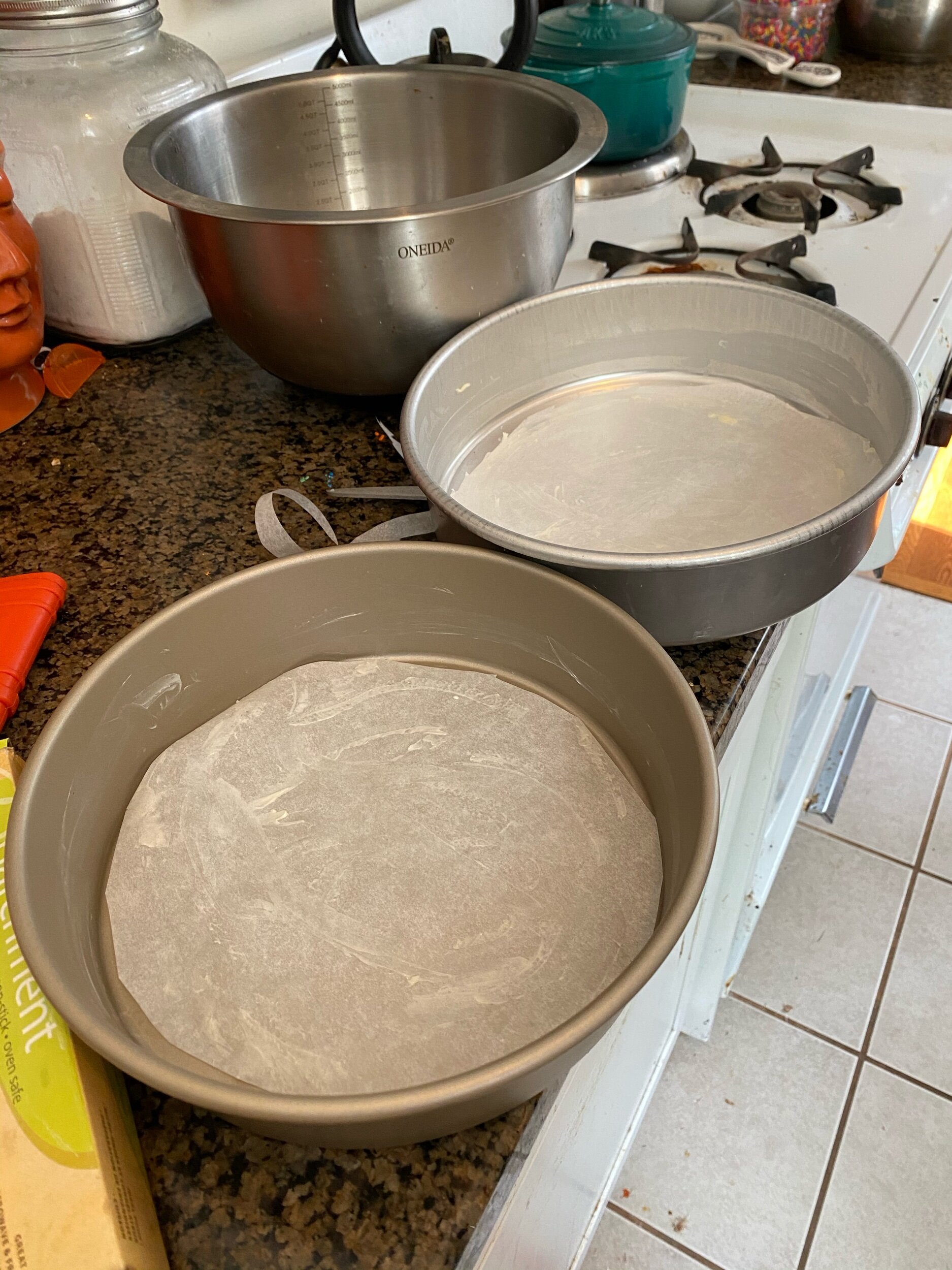 CuT parchment paper the sizE of the bottom of each cake pan, butter and lightly flour. Tap the excess out if the pan. Put aside.