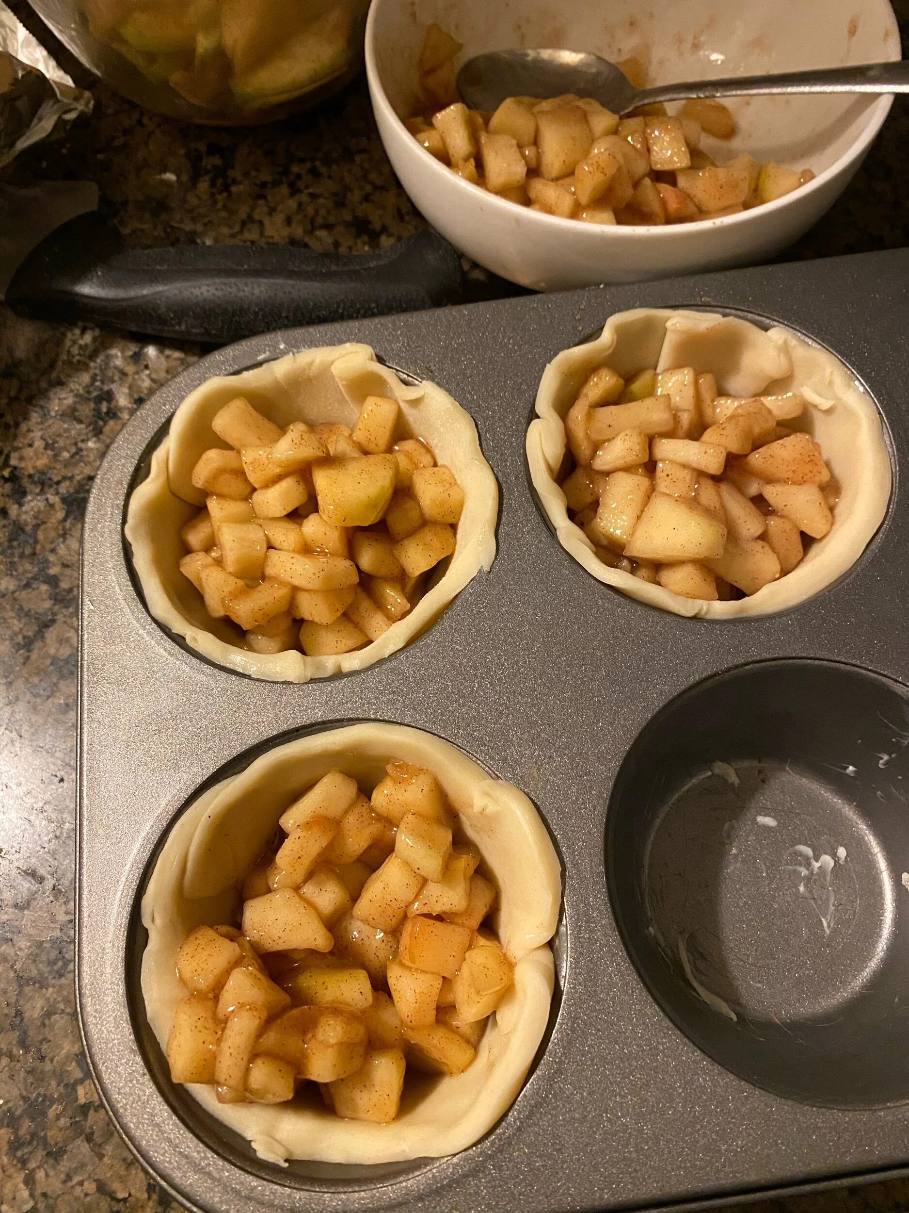 Generously fill your muffins with your cooled apple mixture.