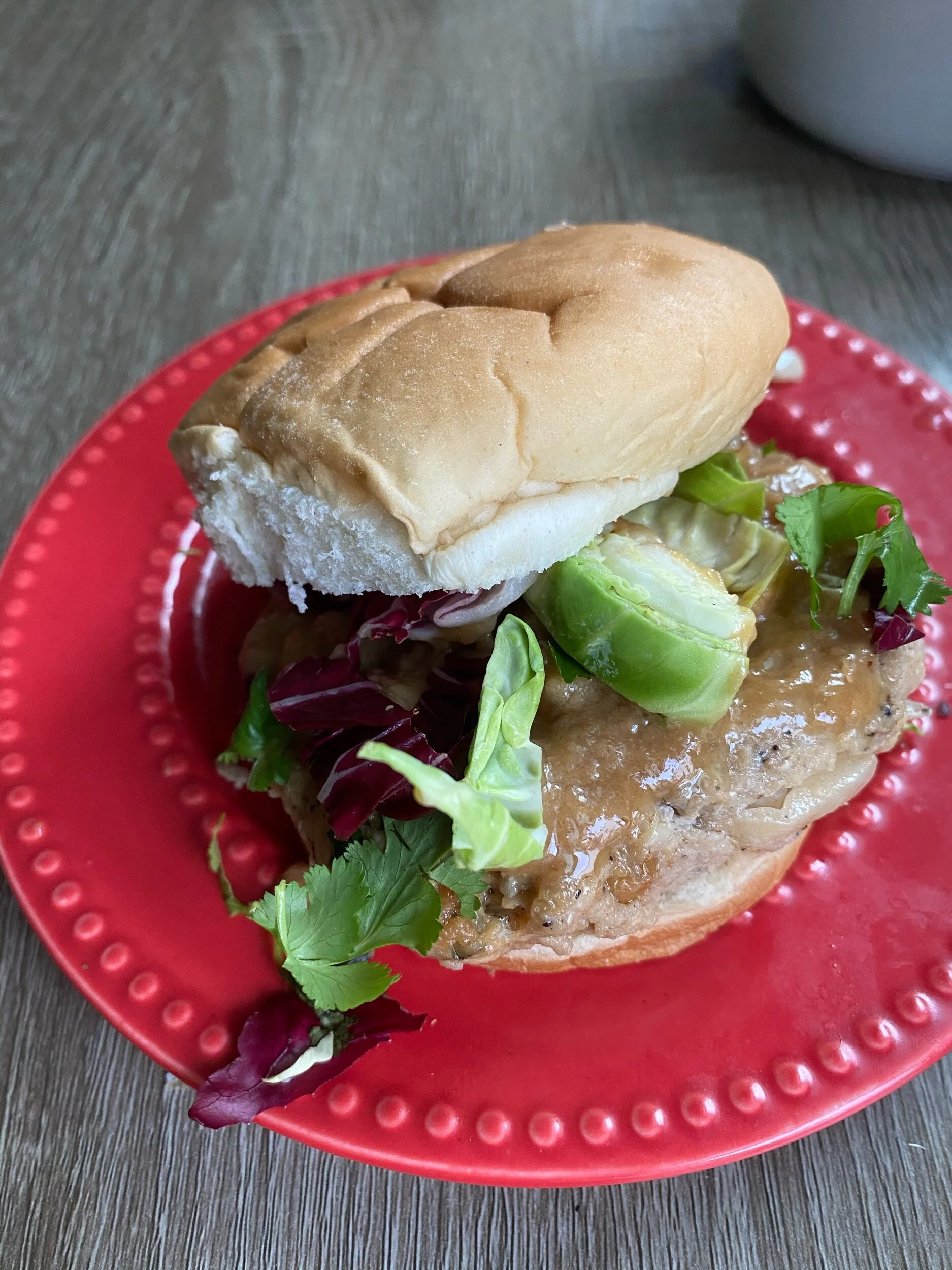 Thai burger assembled with sauce and slaw
