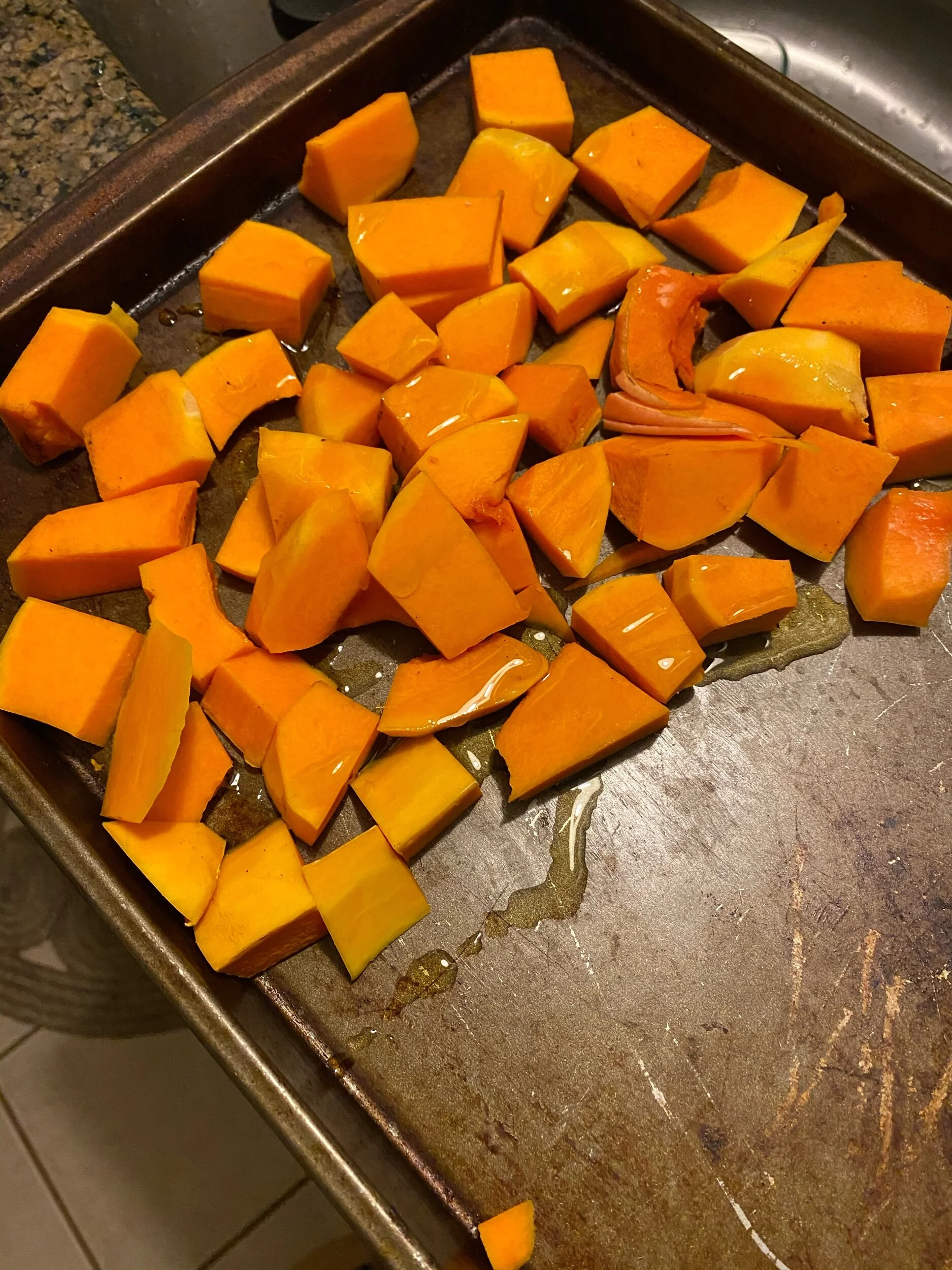 Preheat the oven to 375 degrees.  Chop the butternut squash, toss in olive oil and season with salt, pepper and crushed red pepper flakes. Roast for 15 minutes.