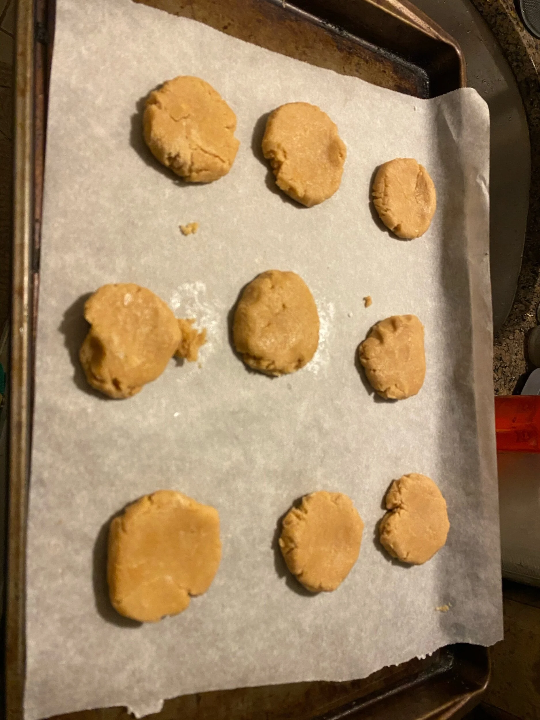 Either using a glass of your CLEAN AND WASHED HAND press them down. Cook for 6-9 minutes (keep checking them)…you’ll know they’re done when the edges are slightly browning…