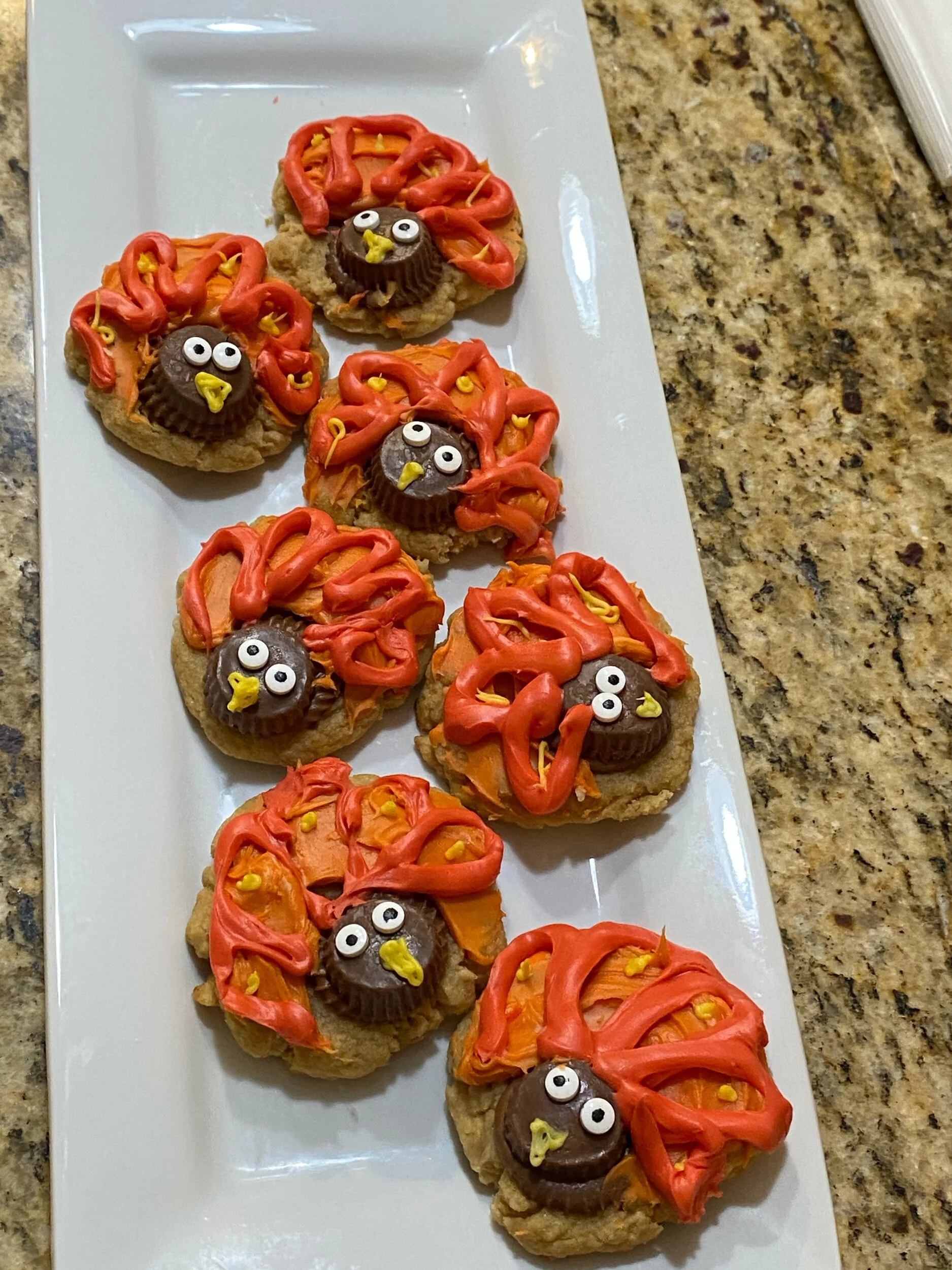 Frosting (in this way) I added a tbs or so of peanut butter to my store bought Betty Crocker Frosting, to more than half of the frosting I added for coloring (red and yellow) to make orange. I frosted the whole cookie with this frosting base and dye…