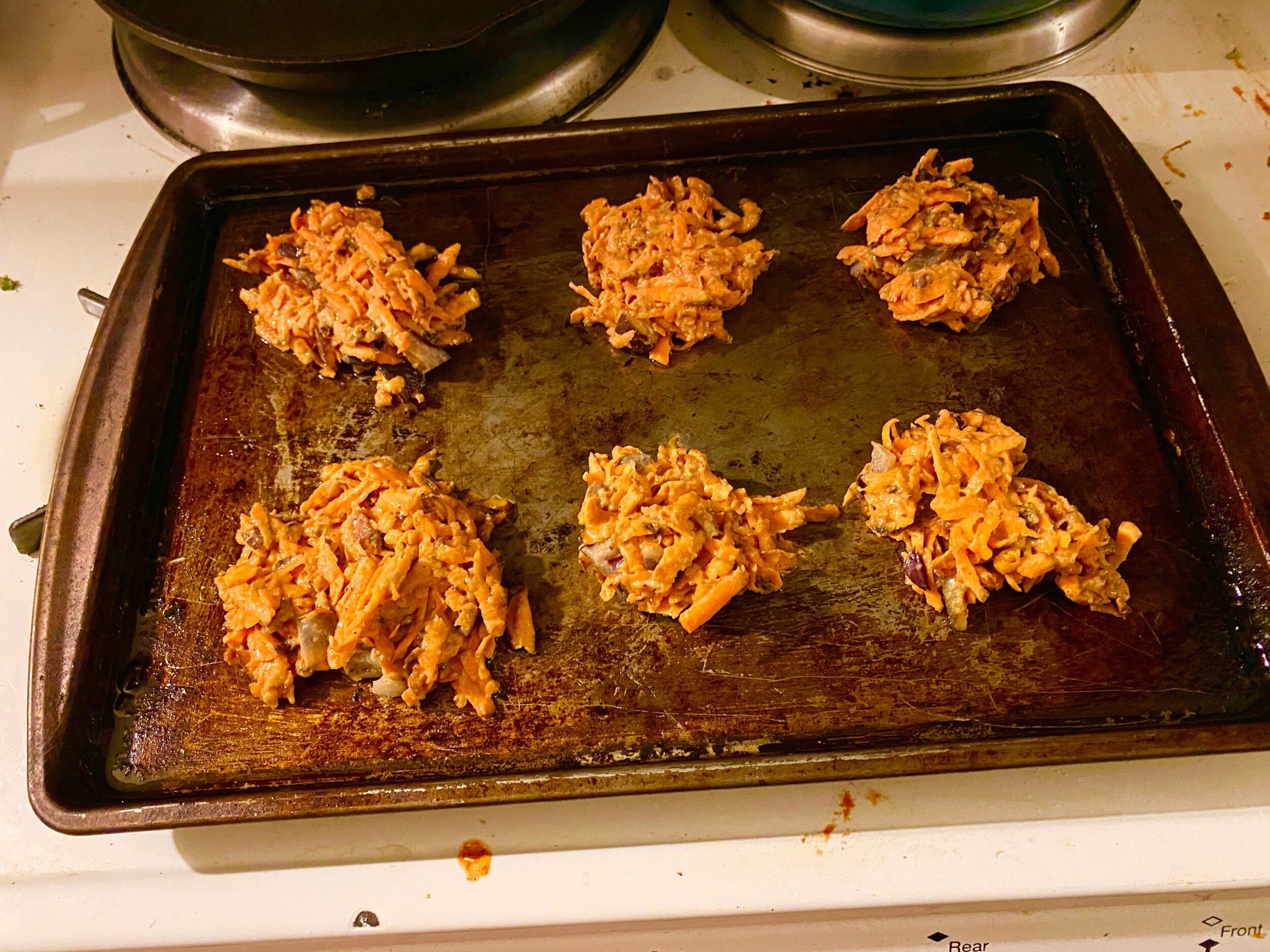 Coat your baking sheet with olive oil and put in the oven for 9-11 minutes. Remove and spoon 6 latke mounds onto the baking sheet. Being careful not to touch the pan, flatten with your fork. Put the latkes in for 15 minutes, remove from the oven, fl…