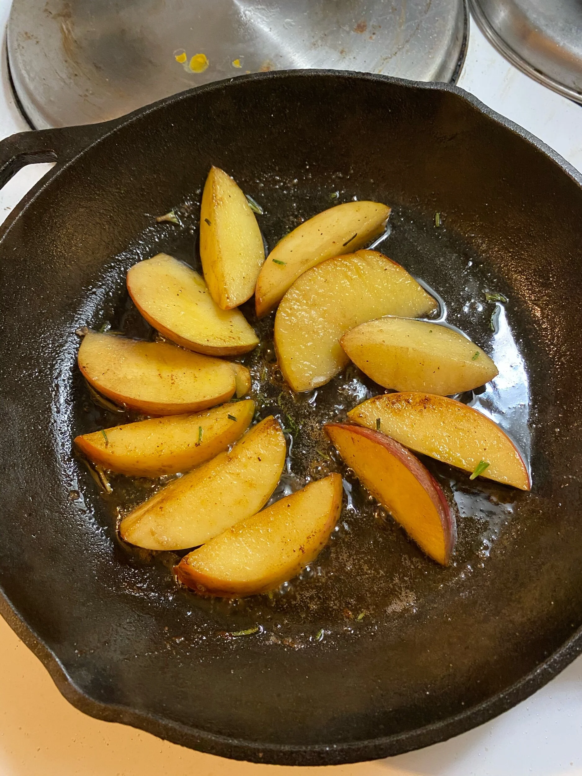 Turn the apple slices so both sides cook evenly - they should be golden in color.