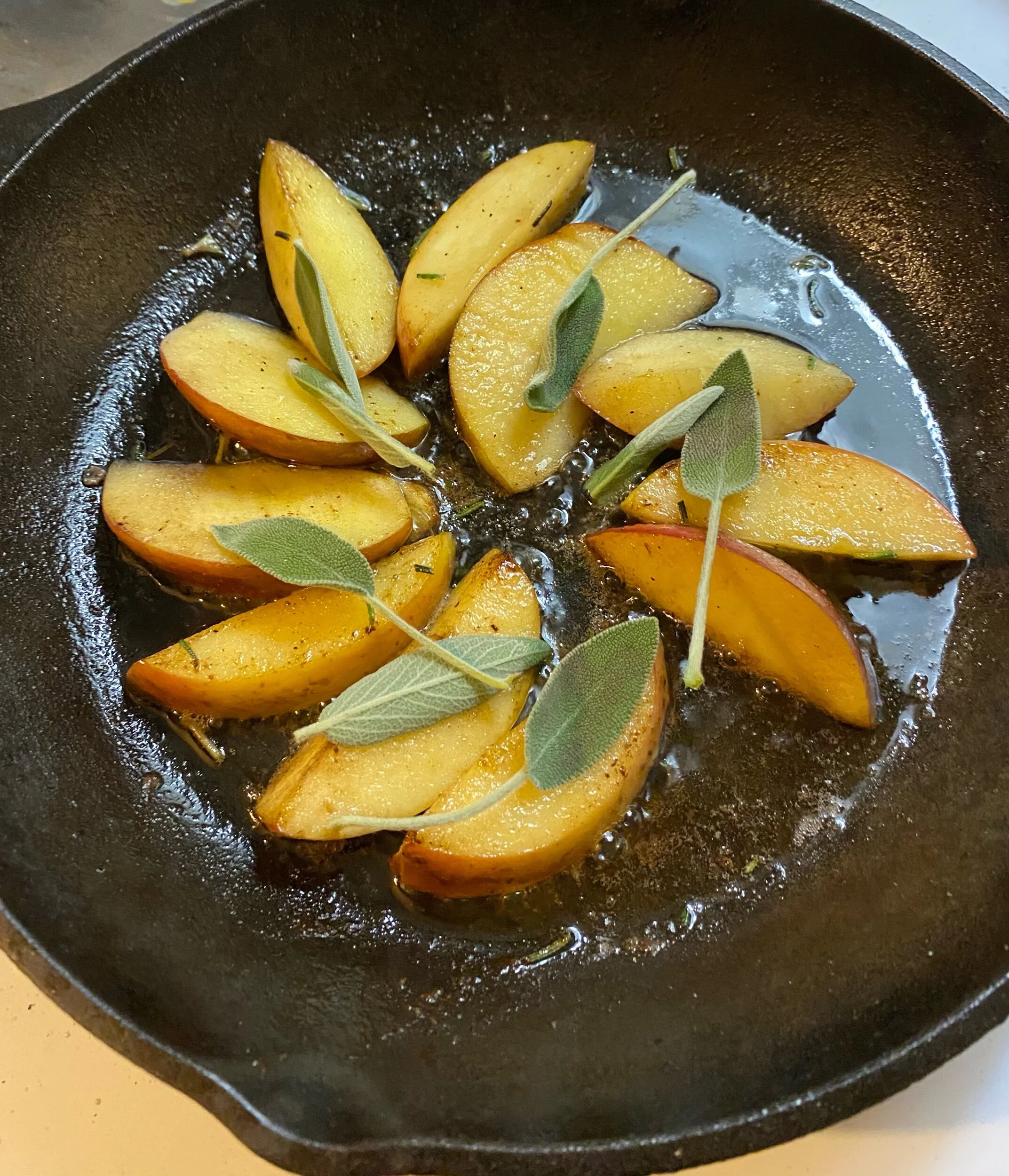 Layer the apple slices with the sage leaves and place the pork chops on top of them. Put in the oven for 15-18 minutes and serve hot, with the apple slices layered on top.