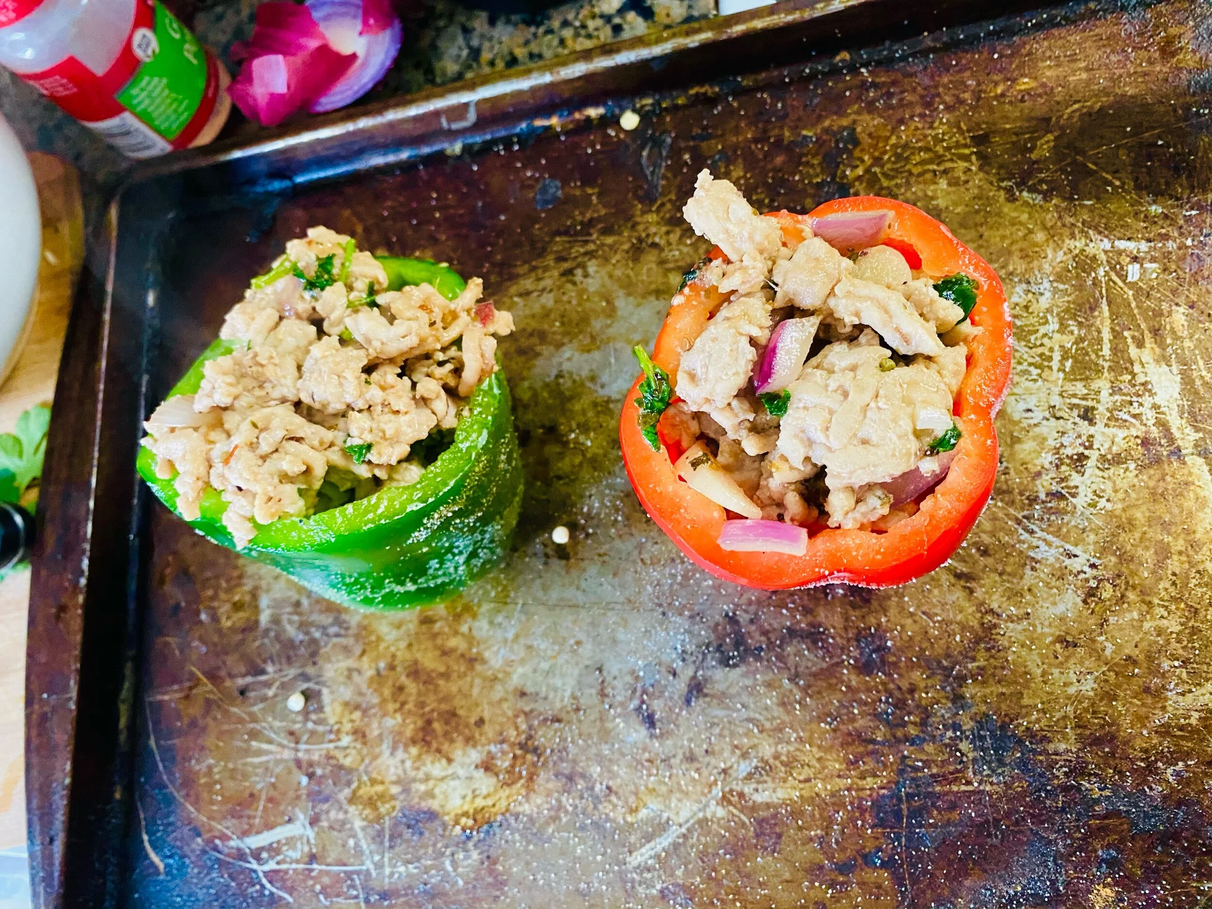 I adjusted from the guide recipe and filled these peppers as I had stuffed peppers before by filling the whole pepper and cutting little pieces off the bottoms so they stand up straight.  Coat the papers in oil, salt and garlic powder. Put the peppe…