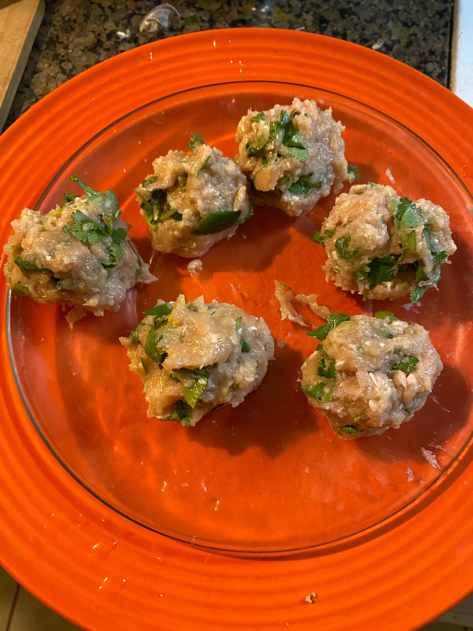 Keep your raw meatballs and cooked meatballs on their own plates. Put aside.