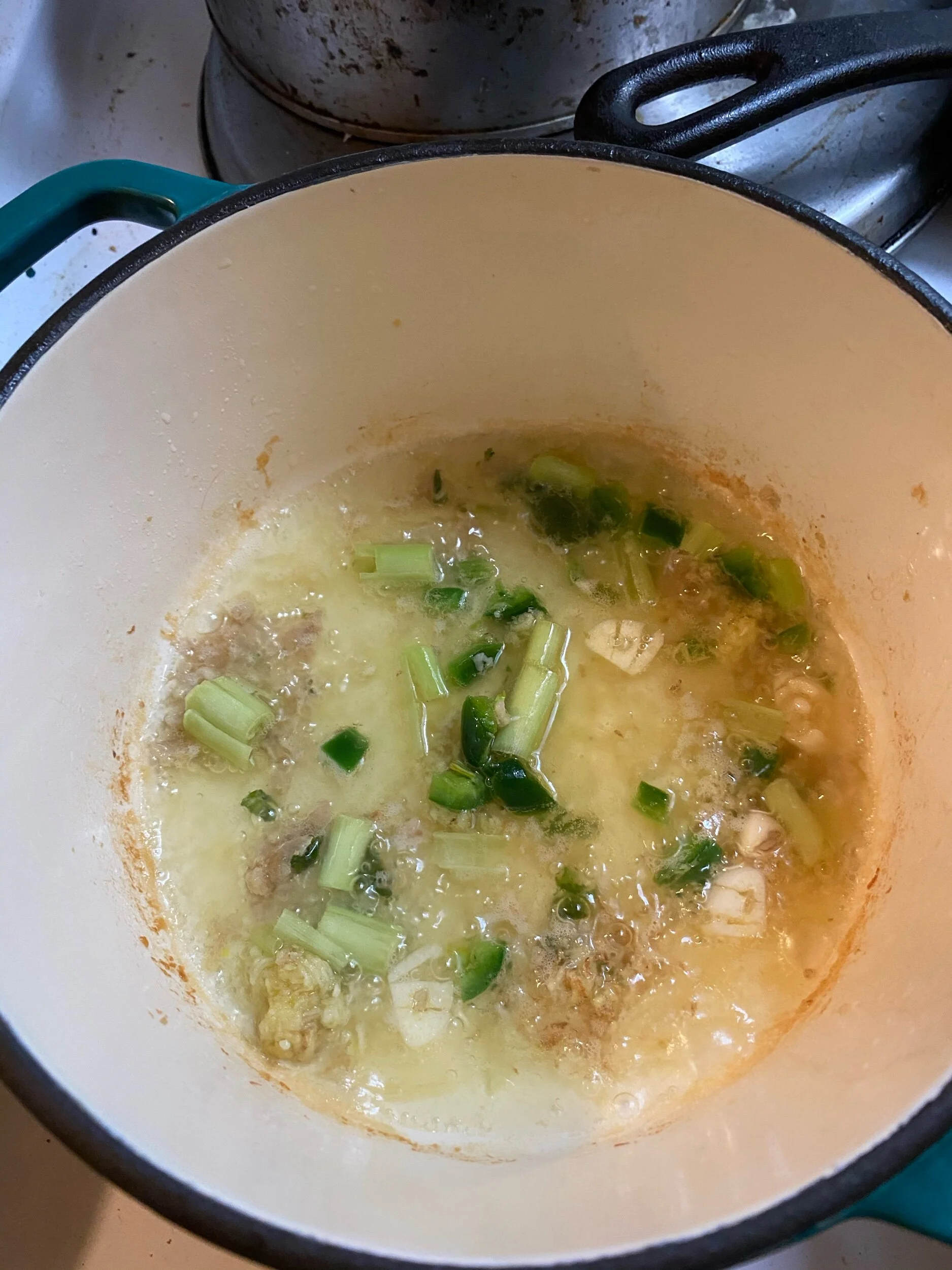 Add the Reserved herbs and lemongrass in your dutch oven. Cook until aromatic and add coconut milk, chicken atock fish sauce and sugar. Cook on medoum fOr 6-9 minutes.