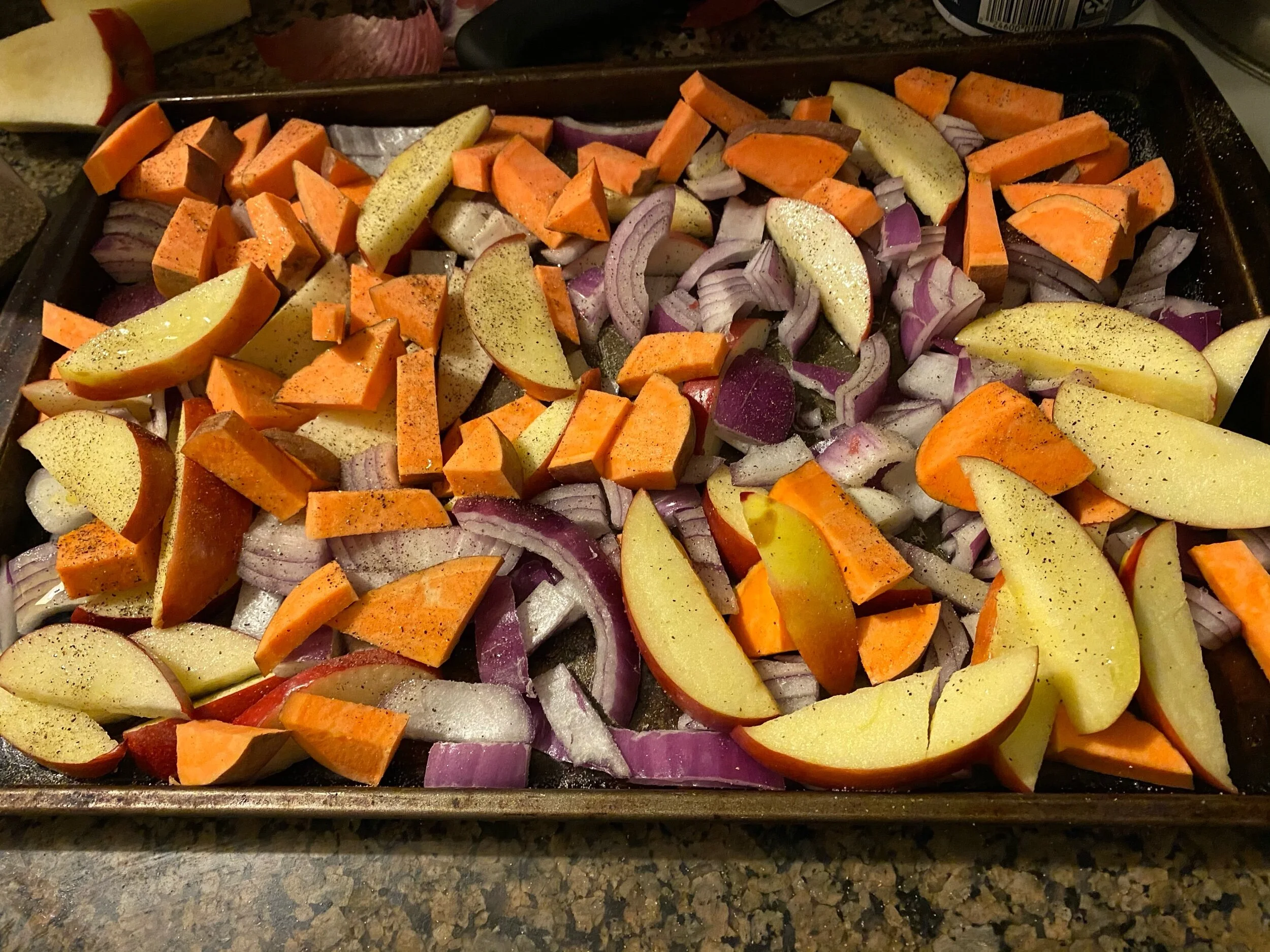 Preheat the oven to 390 degrees. Cut your apples, onions, and sweet potato, toss with oliv eoil and season with salt, pepper, and garlic powder. .
