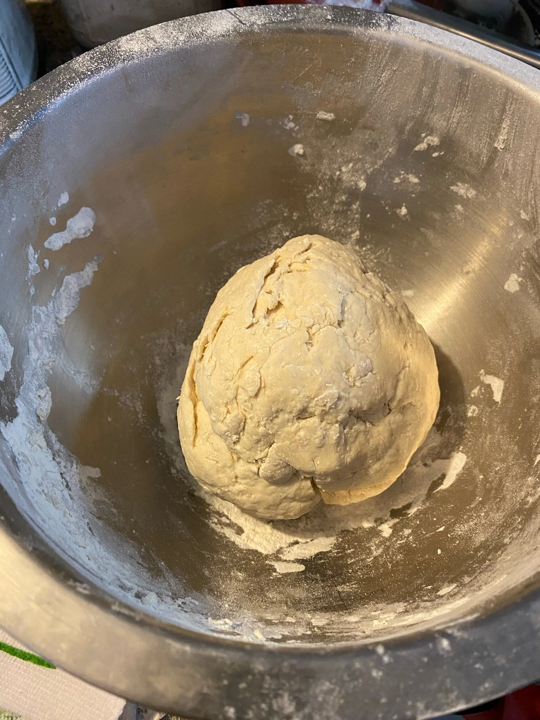 After kneading, place into your mixing bowl and cover with a damp towel. Let it rise for 90-130 minutes