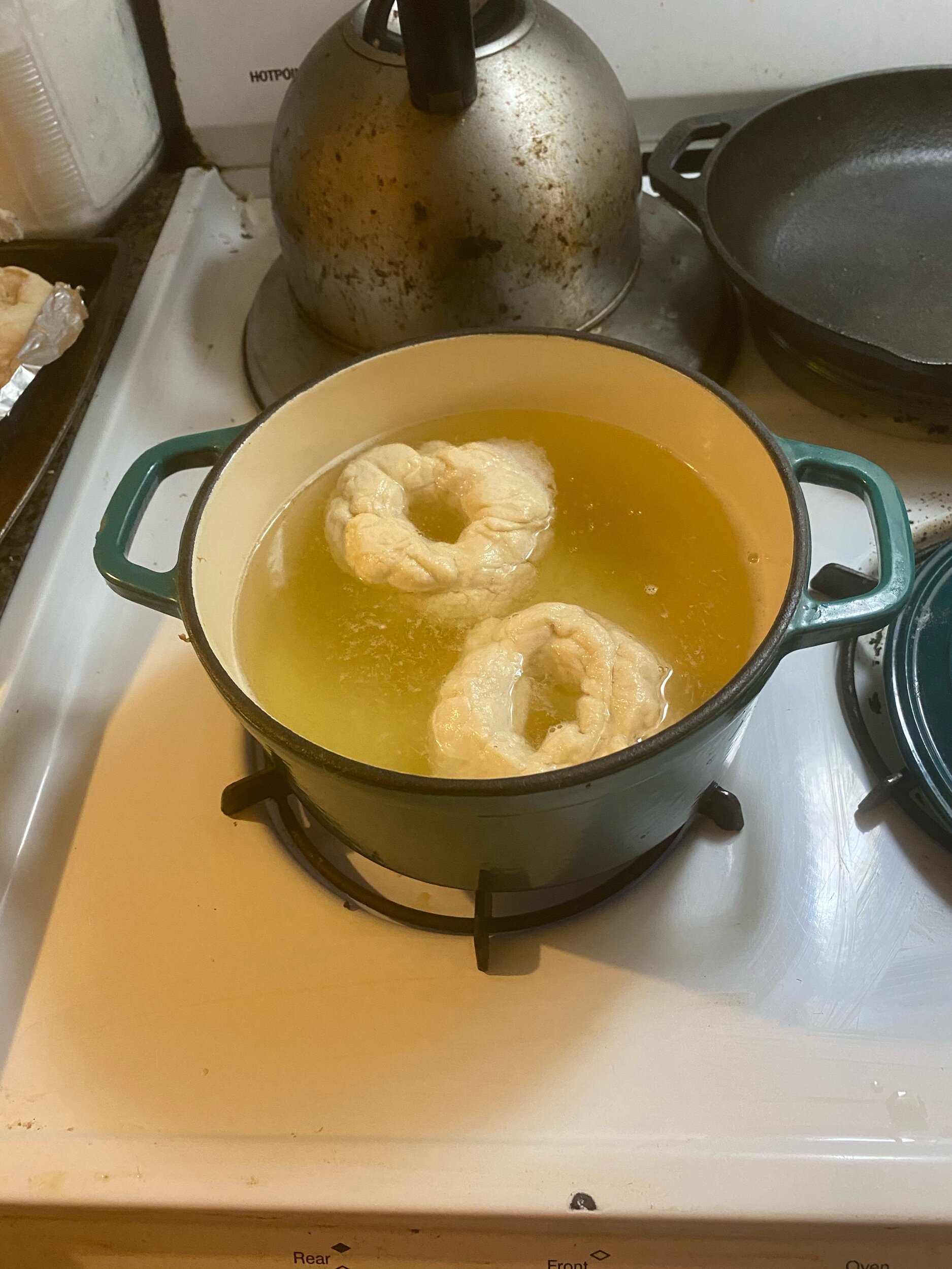 Preheat the oven to 390 degrees. Take a bucket of water and drop a bagel into the bucket to see if it will rise to the top. If it does, they are ready to boil then bake!Fill a dutch oven (you see mine is not so big) with water, the baking soda and 2…