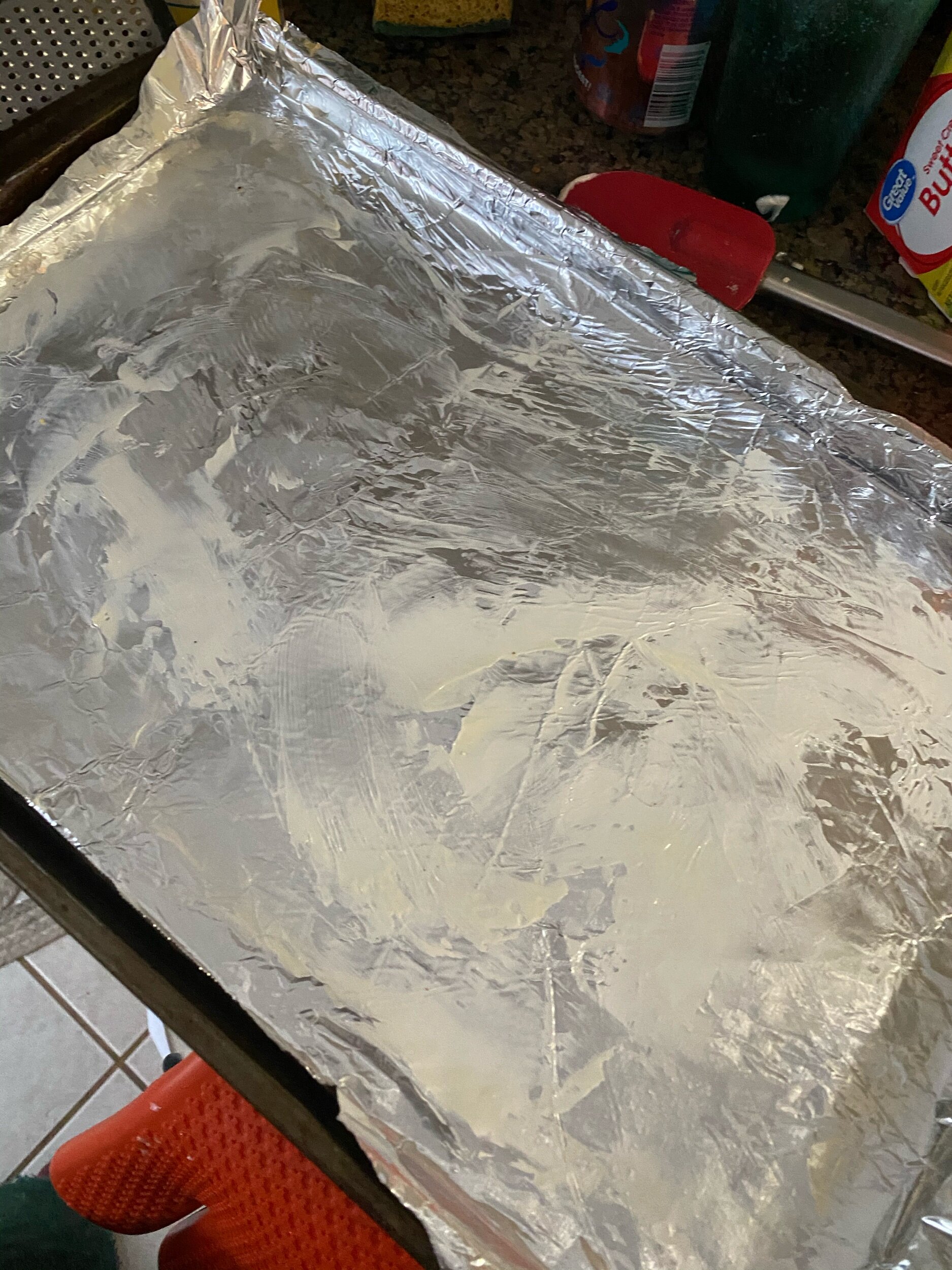 Cover the baking sheet with tin foil and grease with butter or oil.