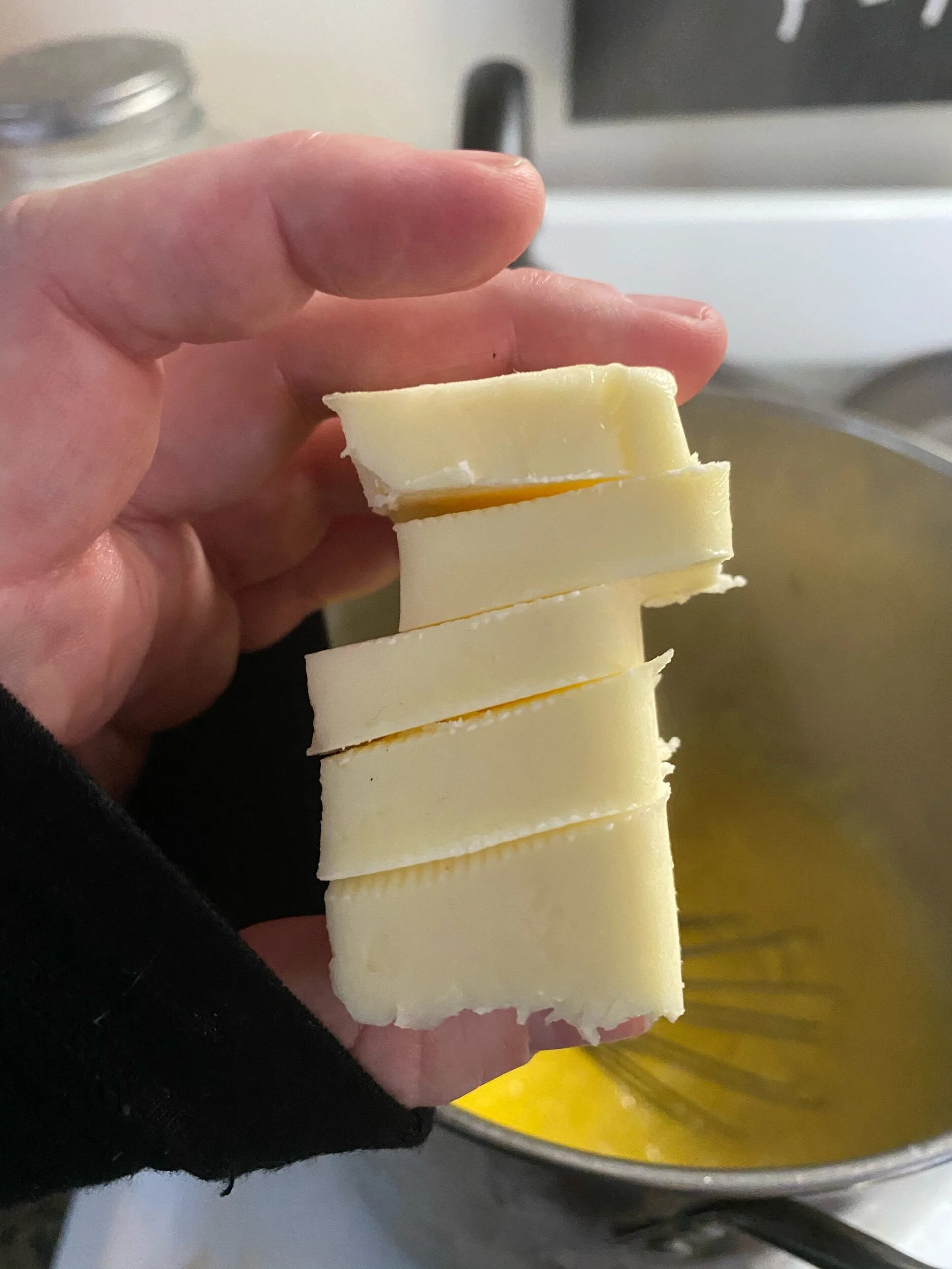 It looks like more butter than it actually is, but don’t be shy! Remember it is being melted into an entire sheet of polenta.  Keep whisking 8- 11 minutes and then whisk in butter.