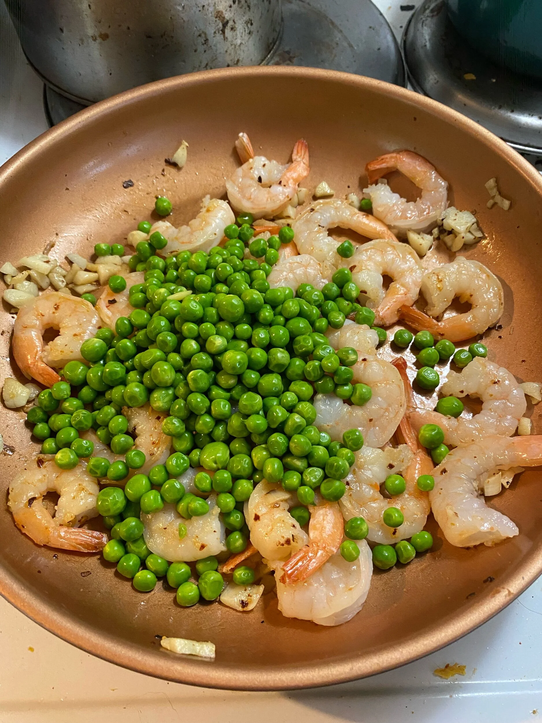 Add the peas, reserved stock and salt to taste.