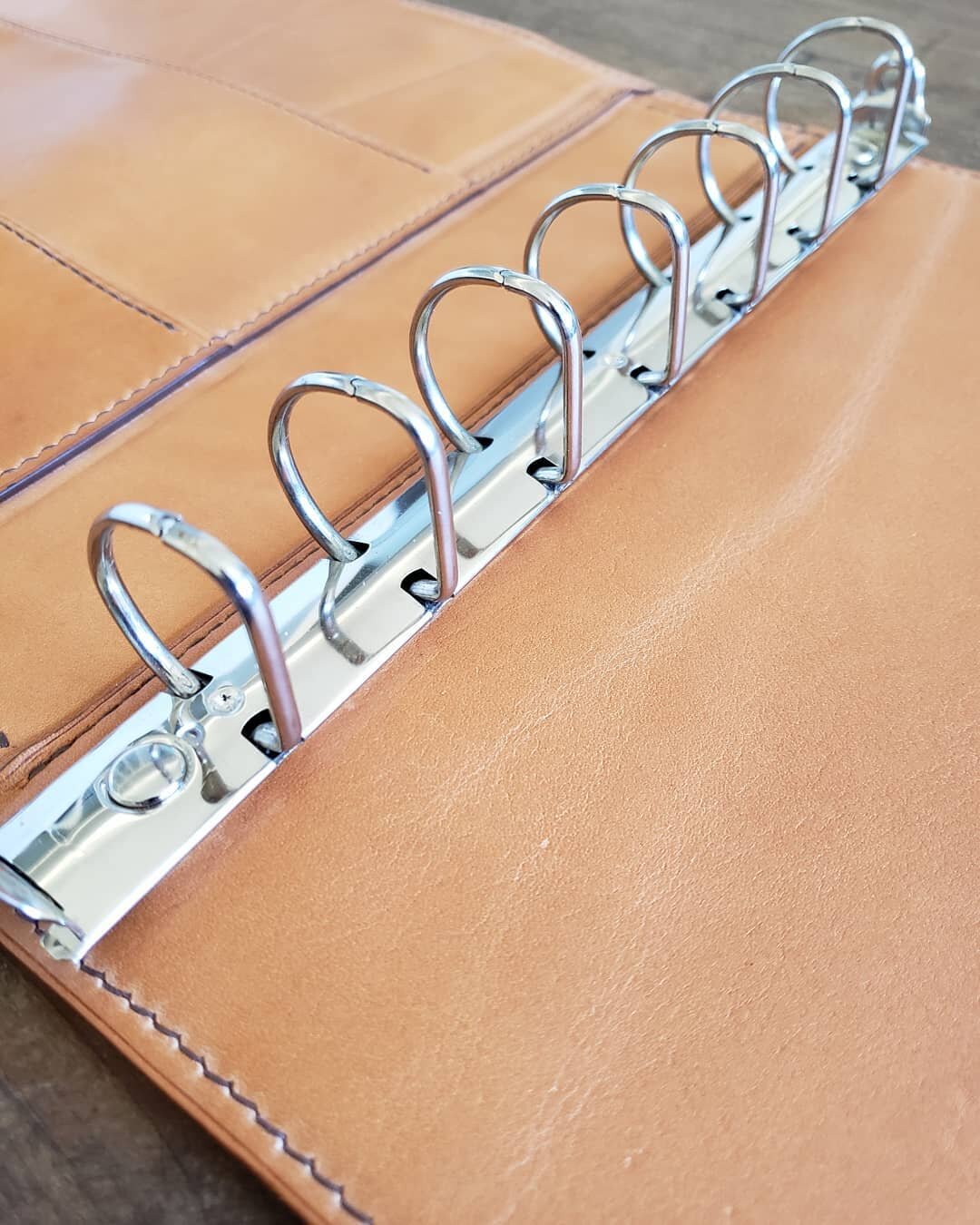 Details of my most recent custom commission.  It turns out 7 ring binder mechanisms are not so easy to find, so I actually had to salvage this one from another binder. 

#binder #leatherbinder #business #details #leatherwork #italianleather #handmade