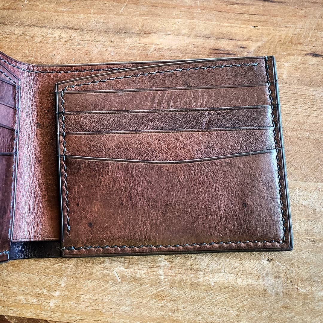 Here's a closer look at the new billfold style I now offer.  Instead of the hidden pockets,  it has open flaps. I personally prefer this style because I can stash away the things I need less often without having to fumble around for them when I need 