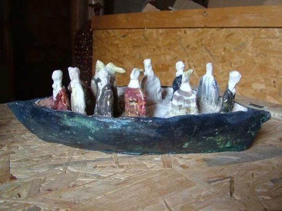 Blue Boat with travelers, ceramic, 15" x 5"d x 5" h, a smaller available also
