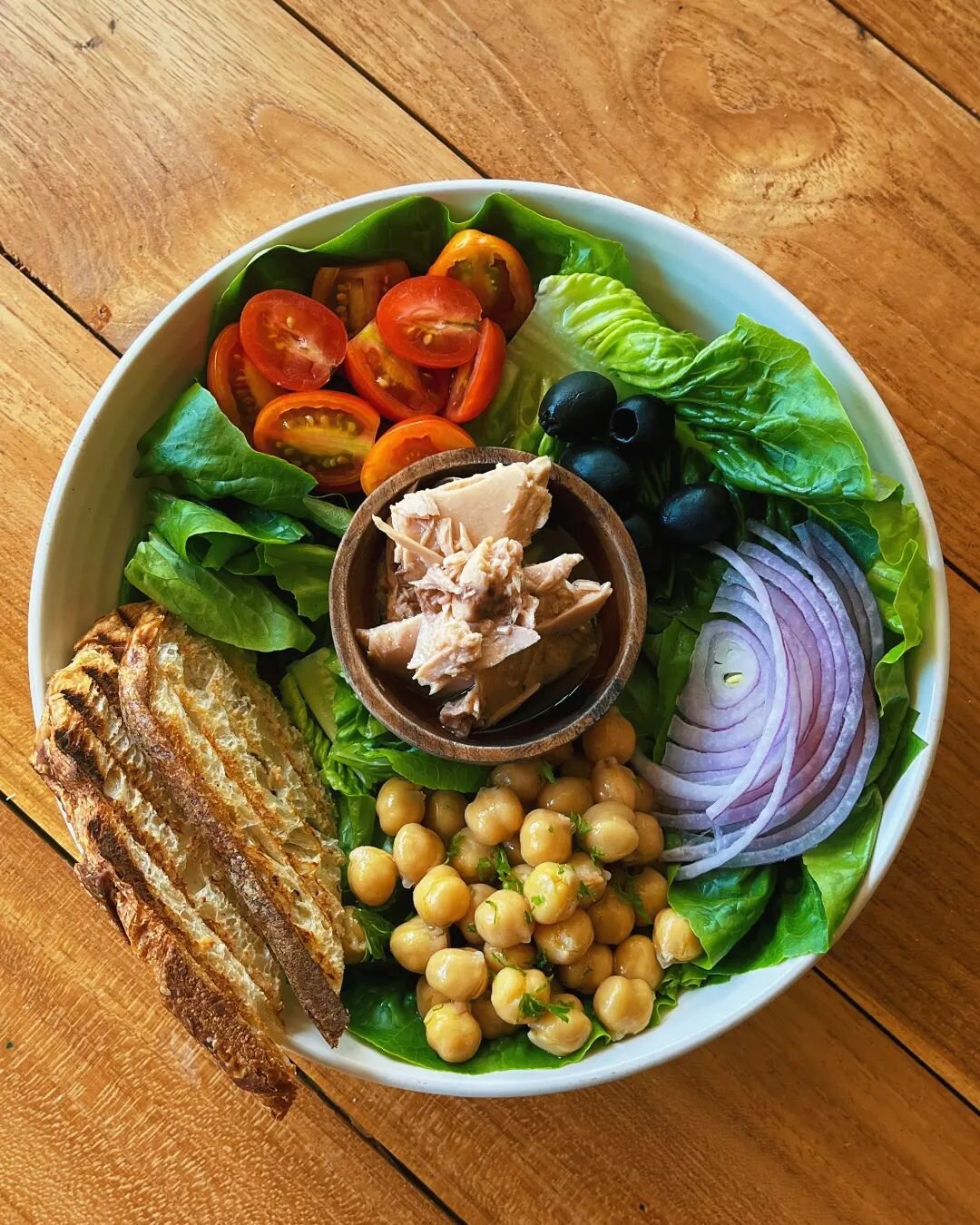 Did you try our salad? 
Packed with proteins and healthy nutrients 🤩 such as tuna, chickpea, black olives, fresh cherry tomatoes and raw red onions over a bed of lettuce. A simple side dressing of olive oil, lemon and mustard complement this mediter