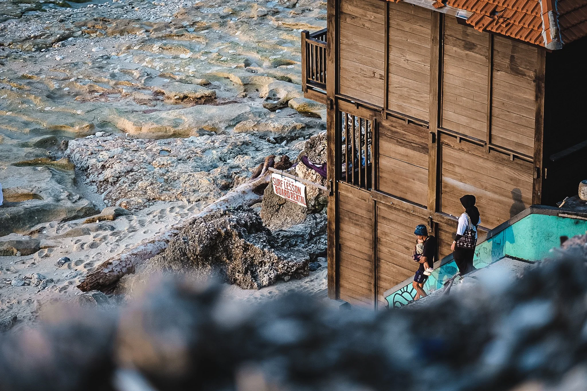 Lifeguard station and surf lessons sign at Bingin Beach, Uluwatu