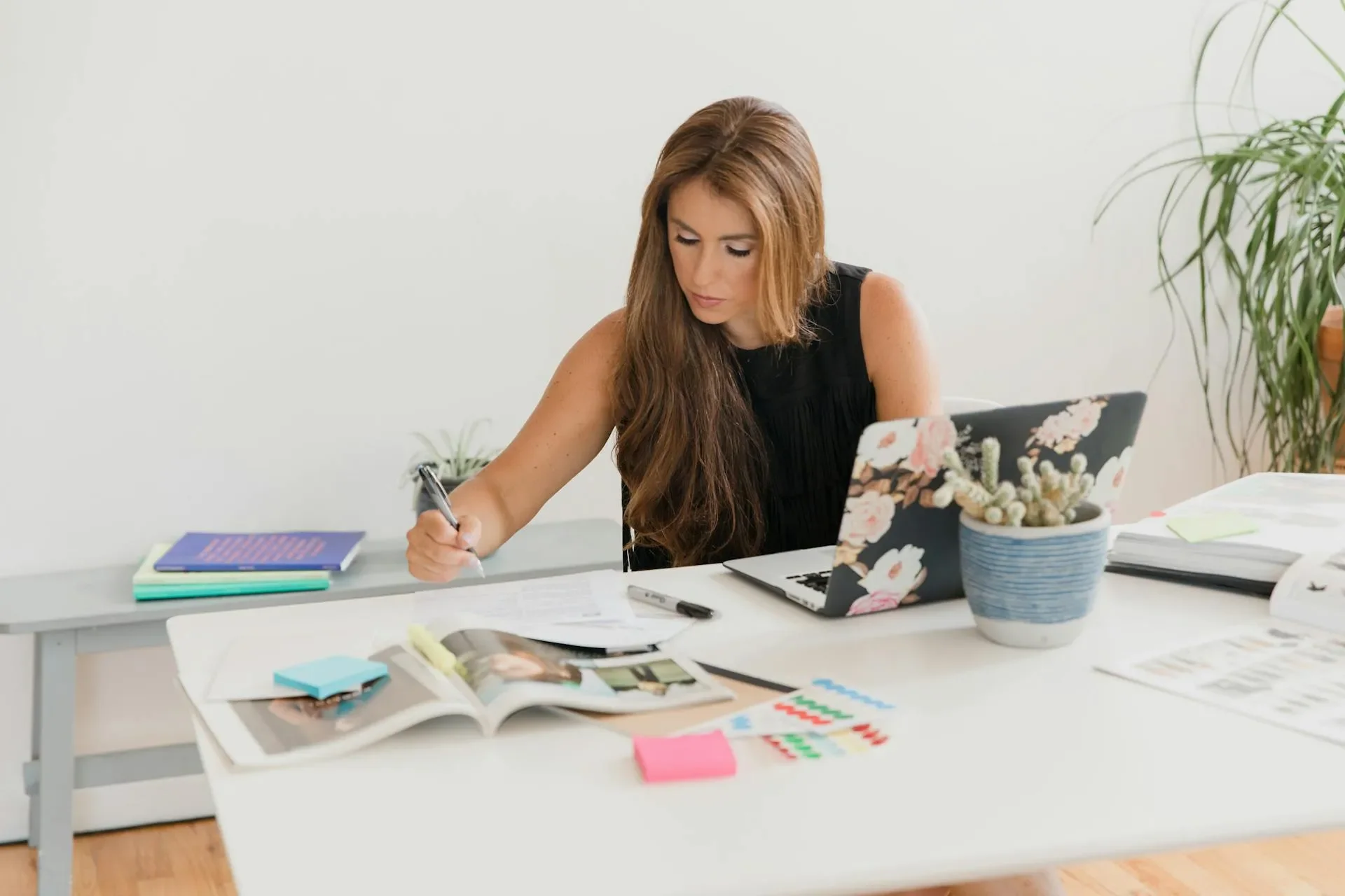 woman sitting at desk working